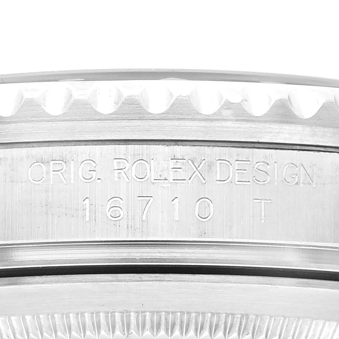 The image shows a close-up of the case with engraving on the Rolex GMT-Master 16710 Men's Stainless Steel Black Dial 16710 Men's Stainless Steel Black Dial model, displaying "ORIG. ROLEX DESIGN 16710 T".