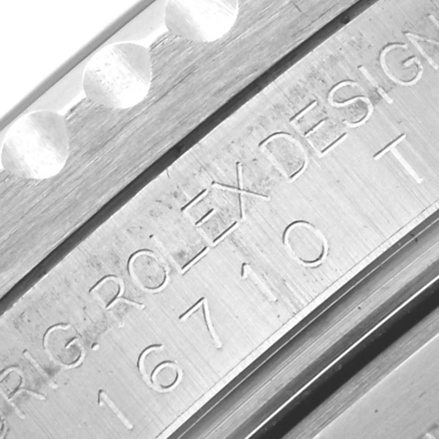 The image shows a close-up view of the case side of a Rolex GMT-Master 16710 Men's Stainless Steel Black Dial 16710 Men's Stainless Steel Black Dial watch, revealing the engraved model number.
