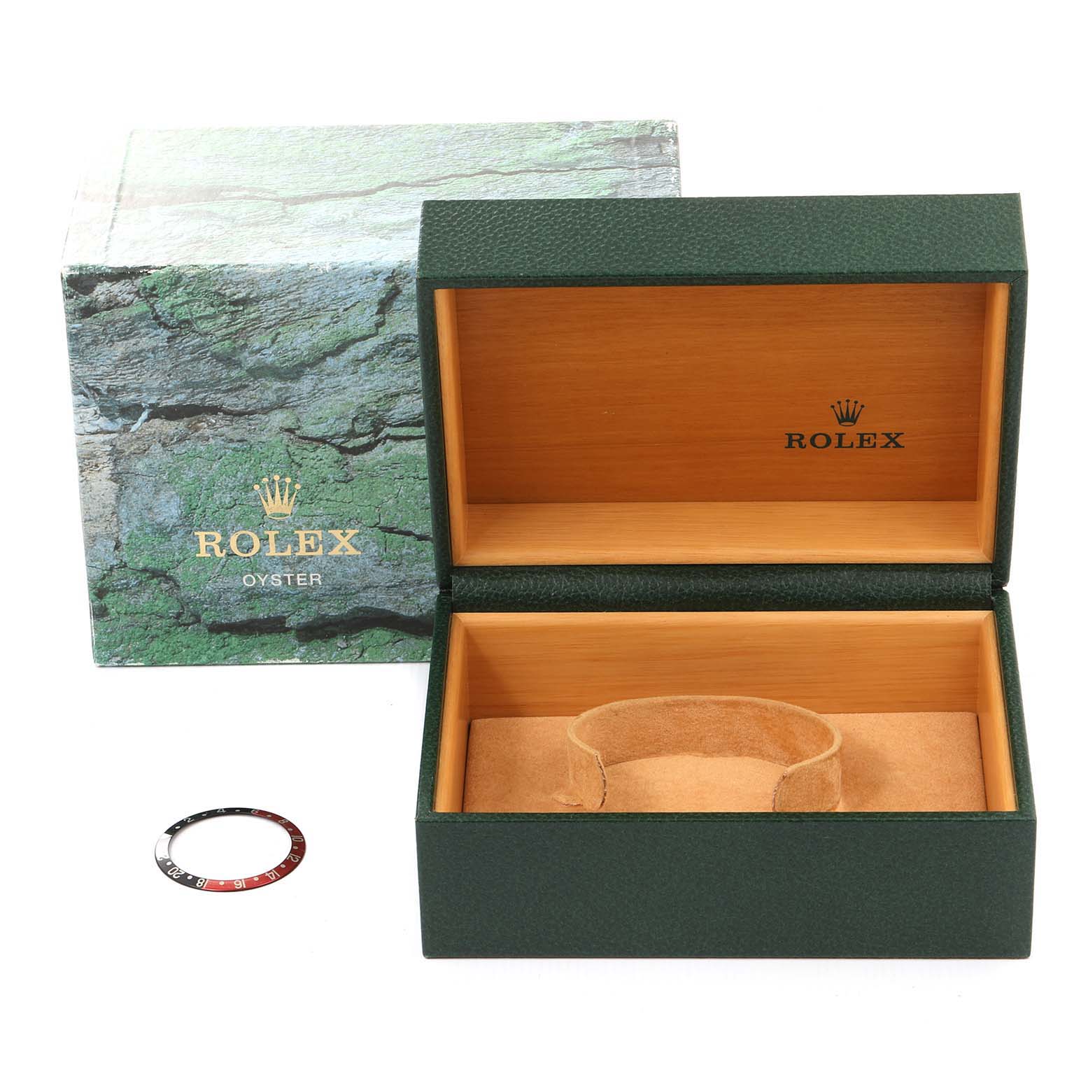 The image shows the box and a bezel insert for a Rolex GMT-Master 16710 Men
s Stainless Steel Black Dial 16710 Men
s Stainless Steel Black Dial watch.