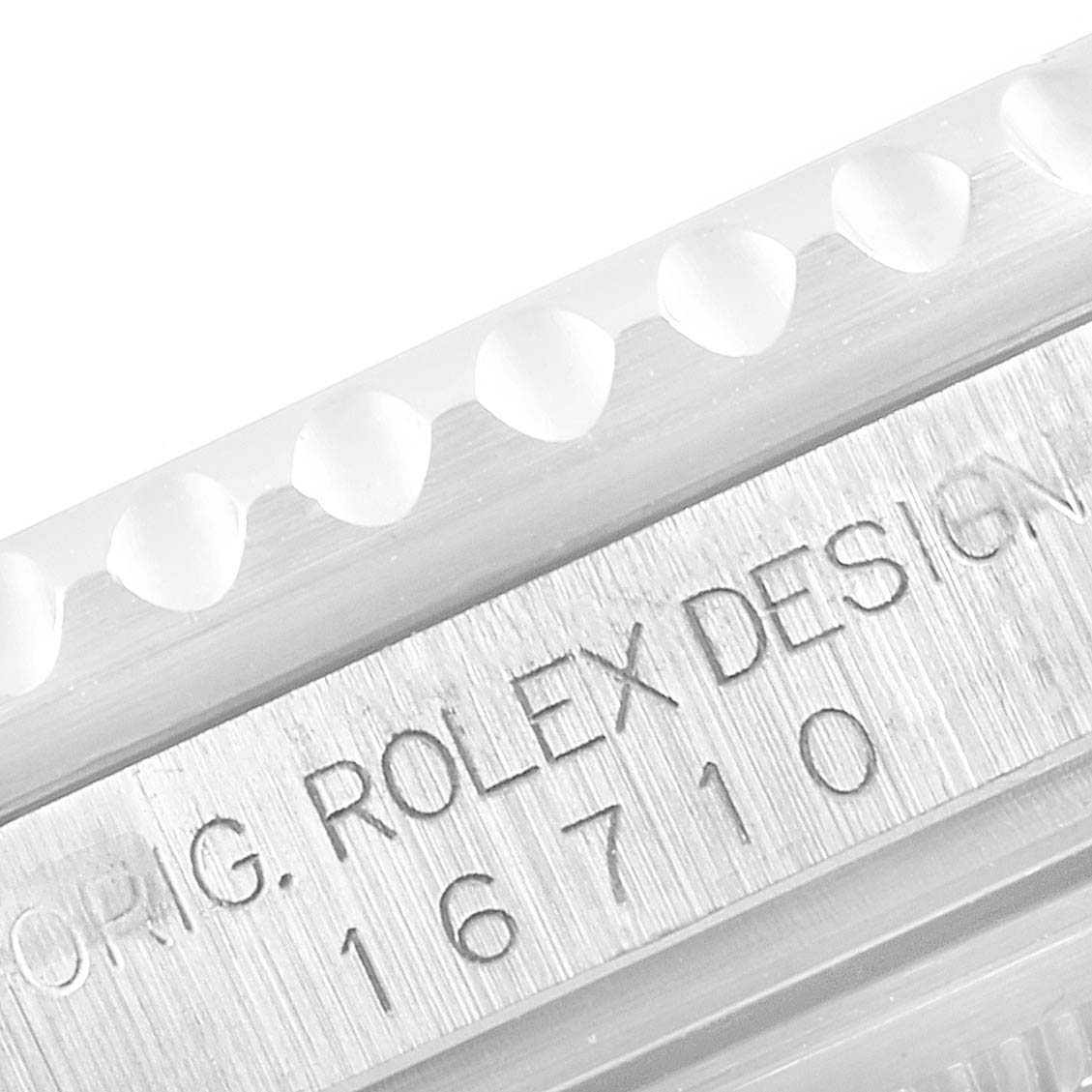 Close-up angle showing the engraved model number "16710" and "ROLEX DESIGN" on the GMT-Master by Rolex.
