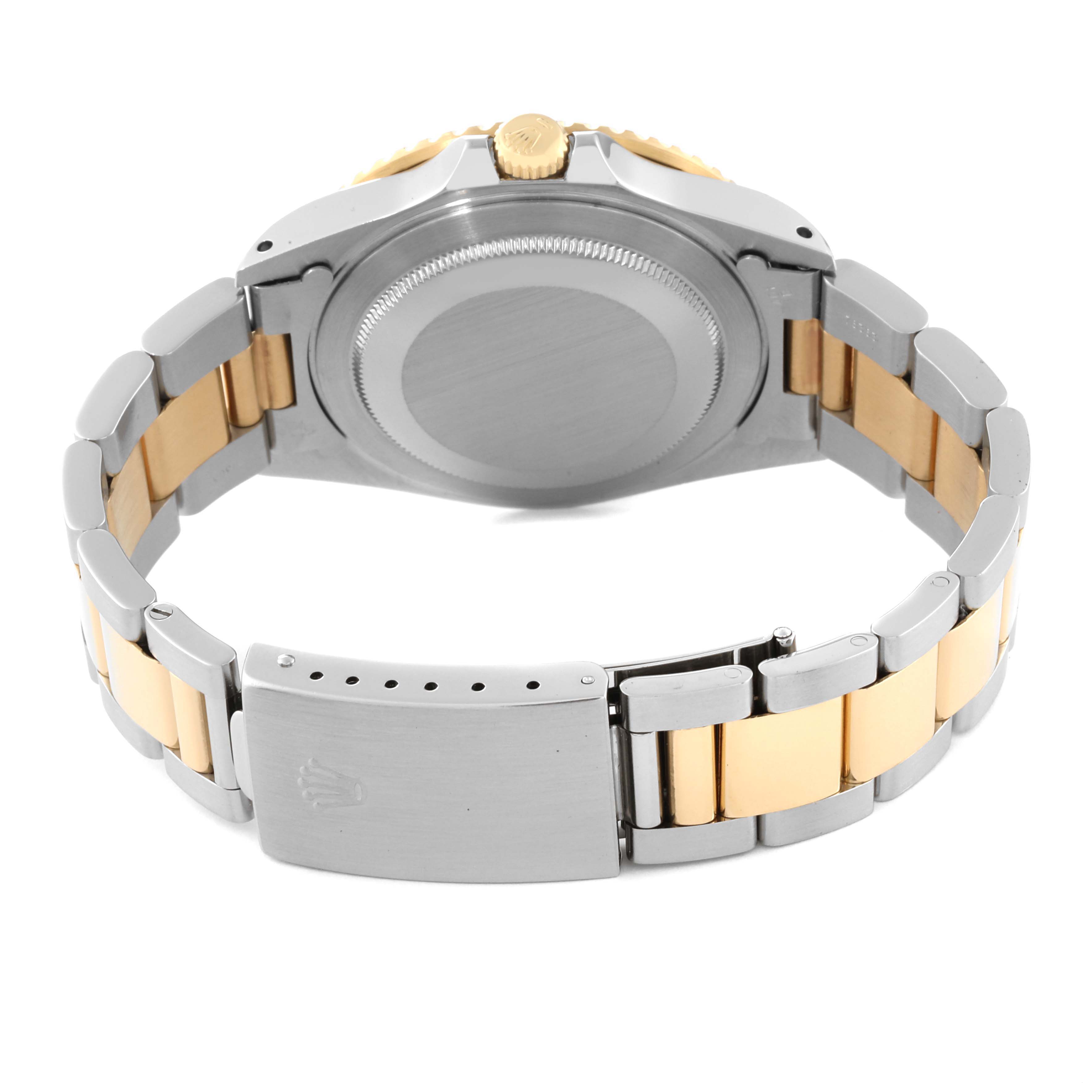 This image shows the back of the Rolex GMT-Master 16713 Men's Steel and Gold (two tone) Black Dial 16713 Men's Steel and Gold (two tone) Black Dial watch, focusing on the clasp and bracelet.