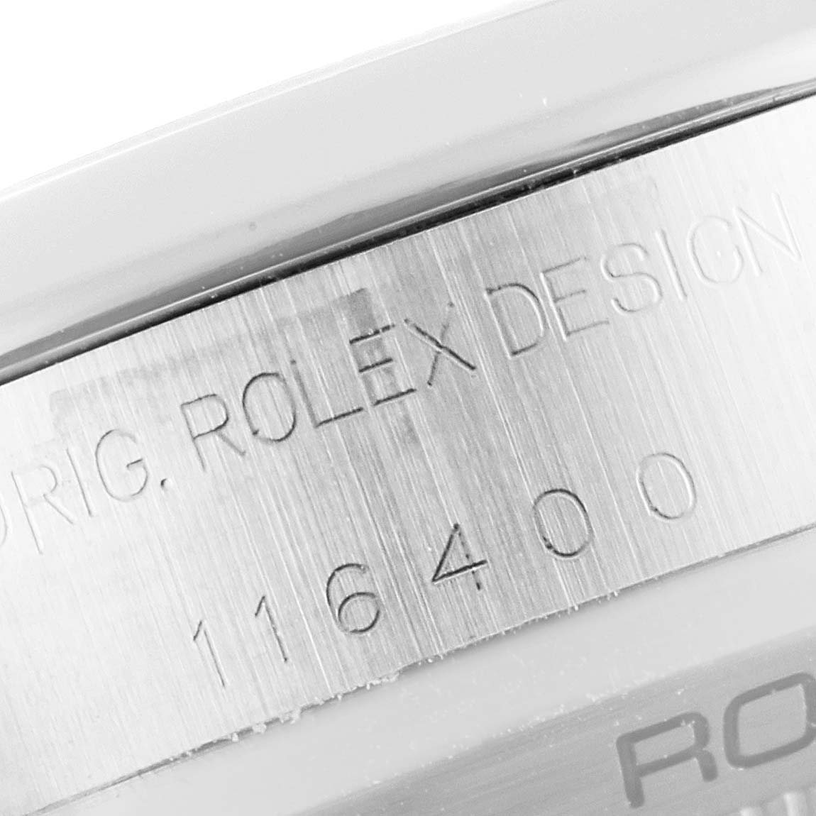 This image shows a close-up of the side of the Rolex Milgauss 116400 Men's Stainless Steel White Dial 116400 Men's Stainless Steel White Dial watch, displaying the model number and brand engraving.