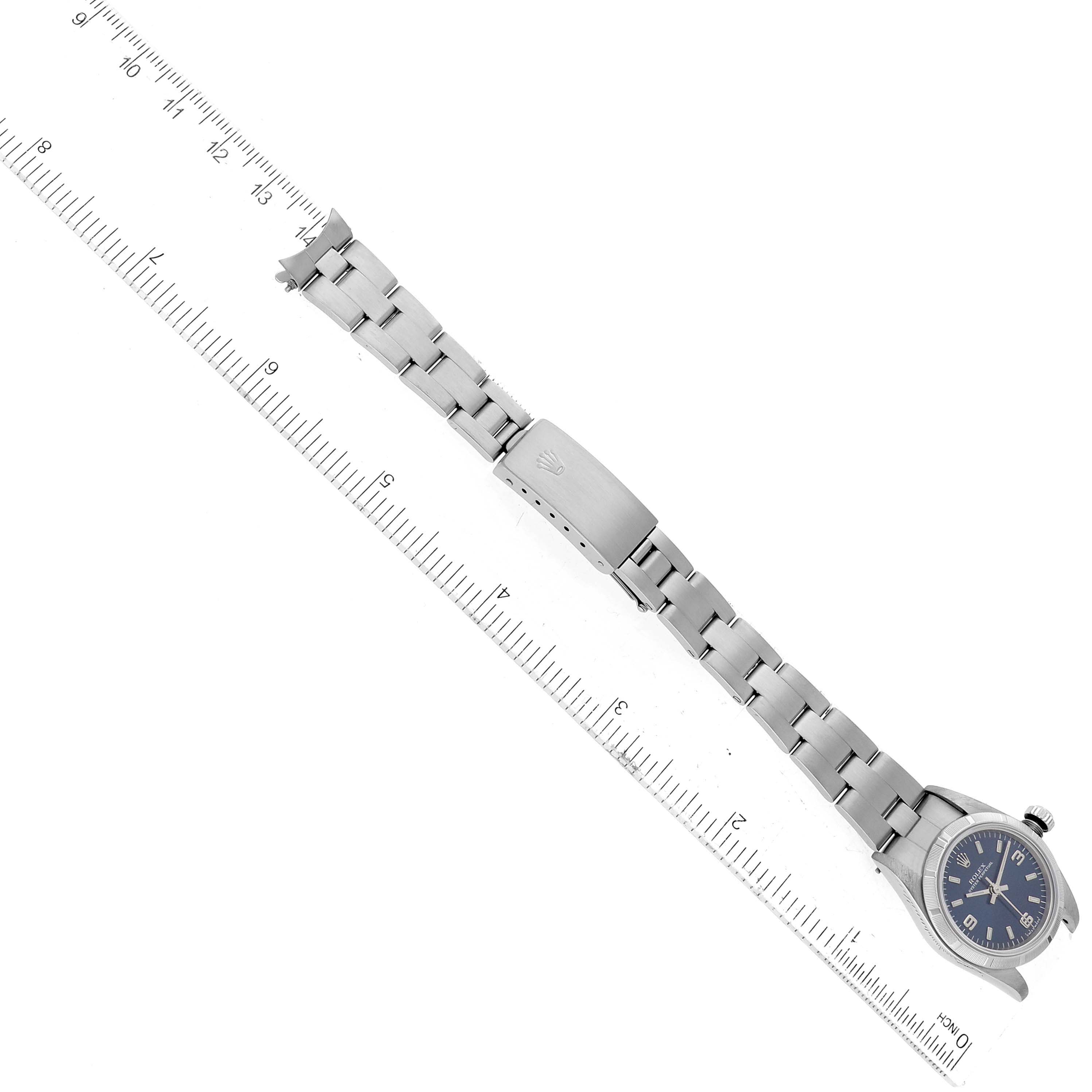 The Rolex Oyster Perpetual 76030 Women's Stainless Steel Blue Dial 76030 Women's Stainless Steel Blue Dial watch is shown flat, featuring the stainless steel band and clasp, along with the watch face and crown.