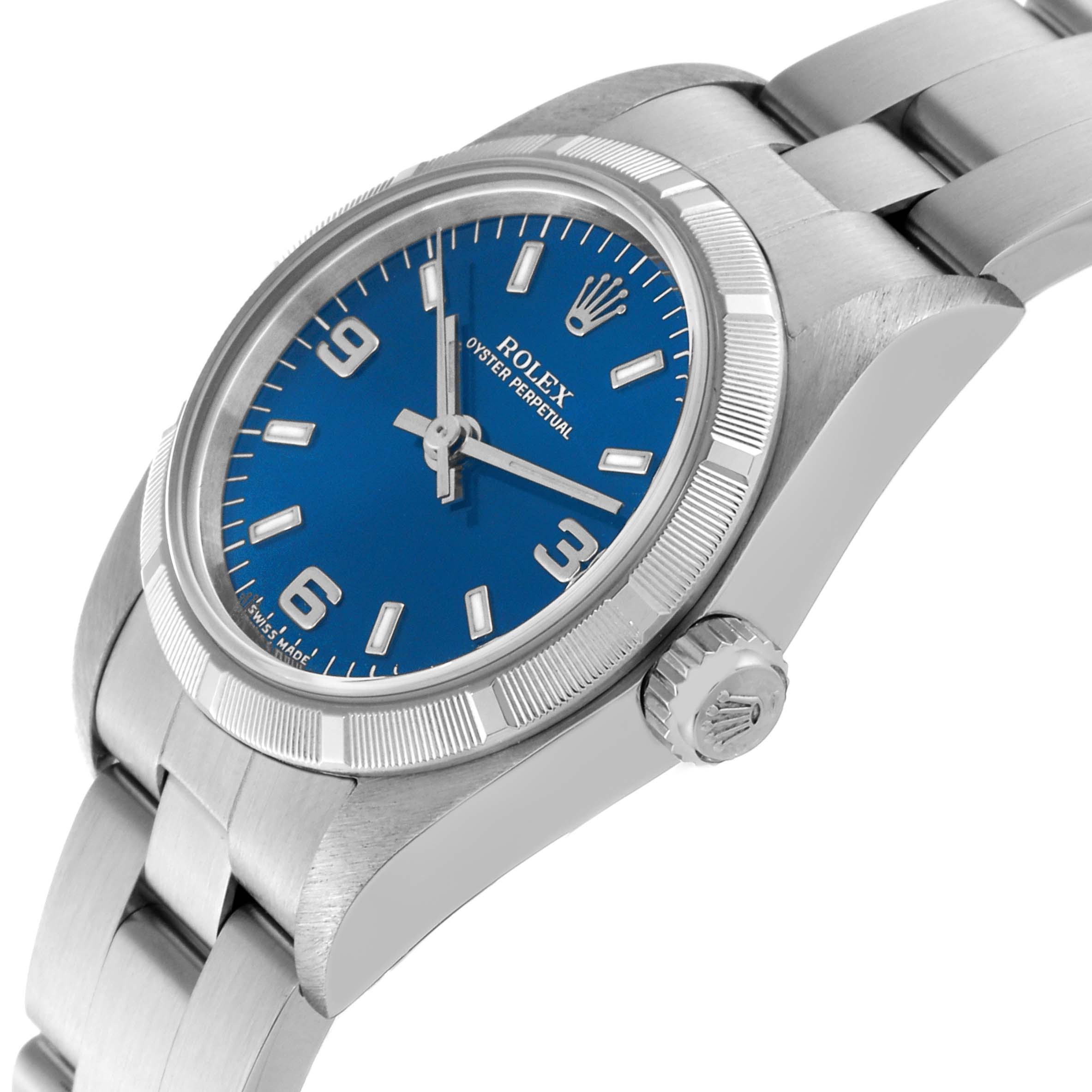 The Rolex Oyster Perpetual 76030 Women's Stainless Steel Blue Dial 76030 Women's Stainless Steel Blue Dial watch is shown at an angle displaying the dial, bezel, crown, and part of the metal bracelet.