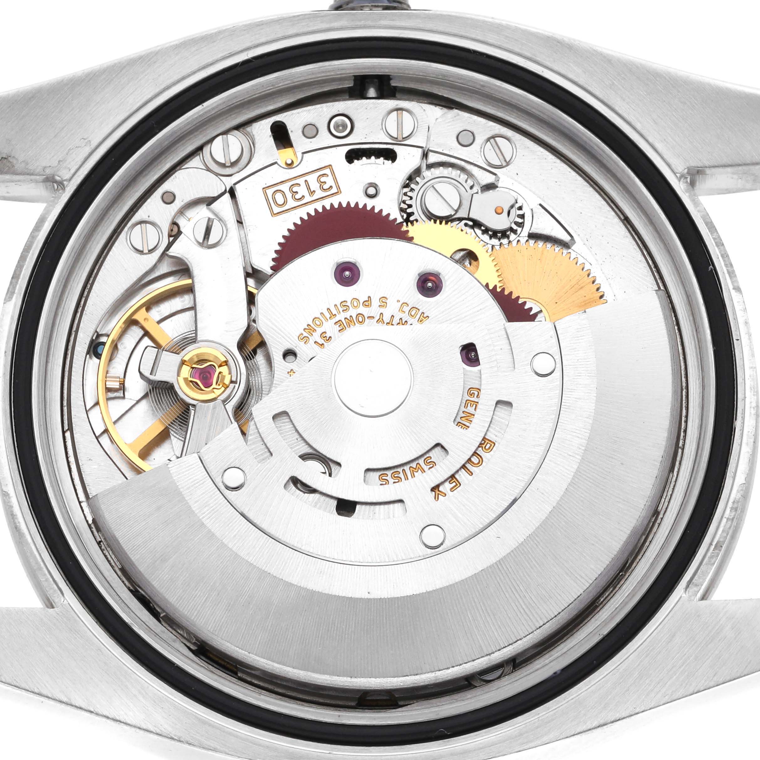 This image shows the internal mechanism of a Rolex Oyster Perpetual 116034 Men's Stainless Steel Black Dial 116034 Men's Stainless Steel Black Dial watch viewed from the back, highlighting gears and movement components.