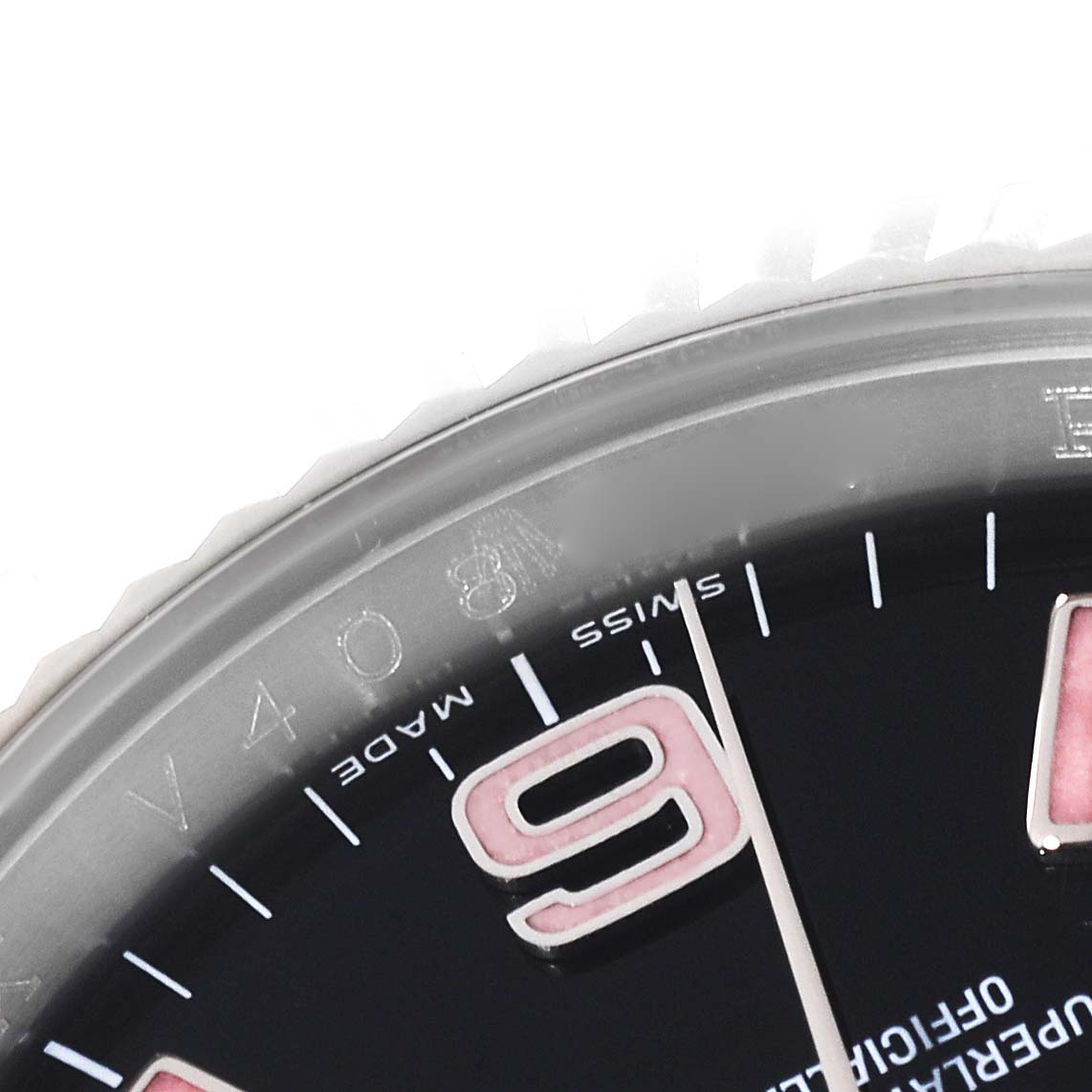 The close-up angle of this Rolex Oyster Perpetual 116034 Men's Stainless Steel Black Dial 116034 Men's Stainless Steel Black Dial watch shows part of the dial and the bezel, highlighting the "9" marker.