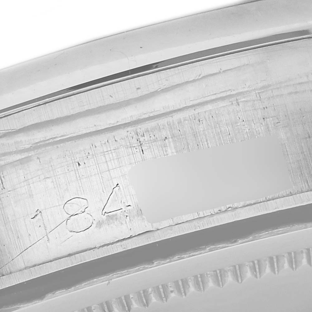 This image shows a close-up of the case and serial number engraving on a Vintage Collection model by Rolex.