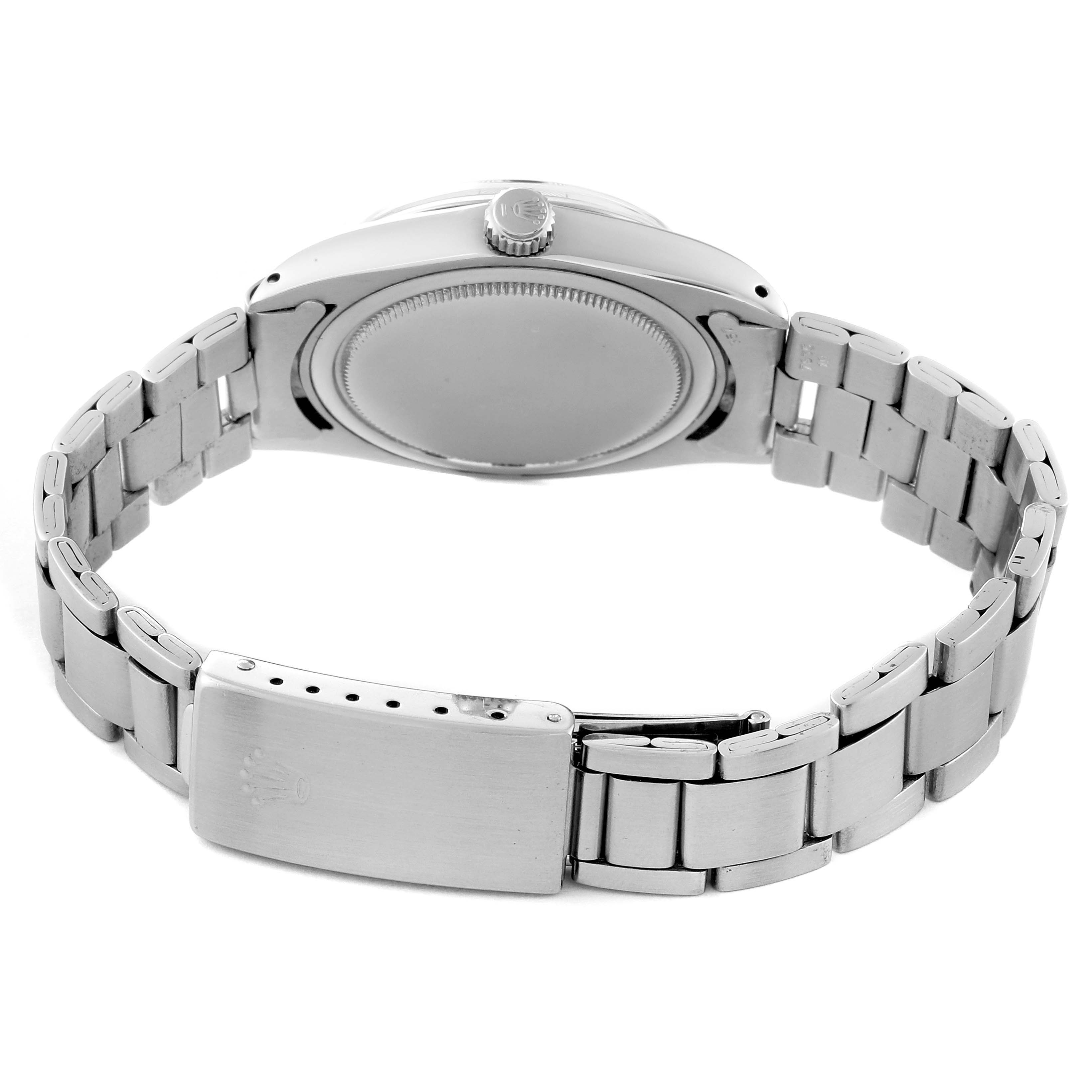 The Rolex Vintage Collection 6694 Men's Stainless Steel Black Dial 6694 Men's Stainless Steel Black Dial watch is shown from the back, highlighting the case back and metal bracelet.