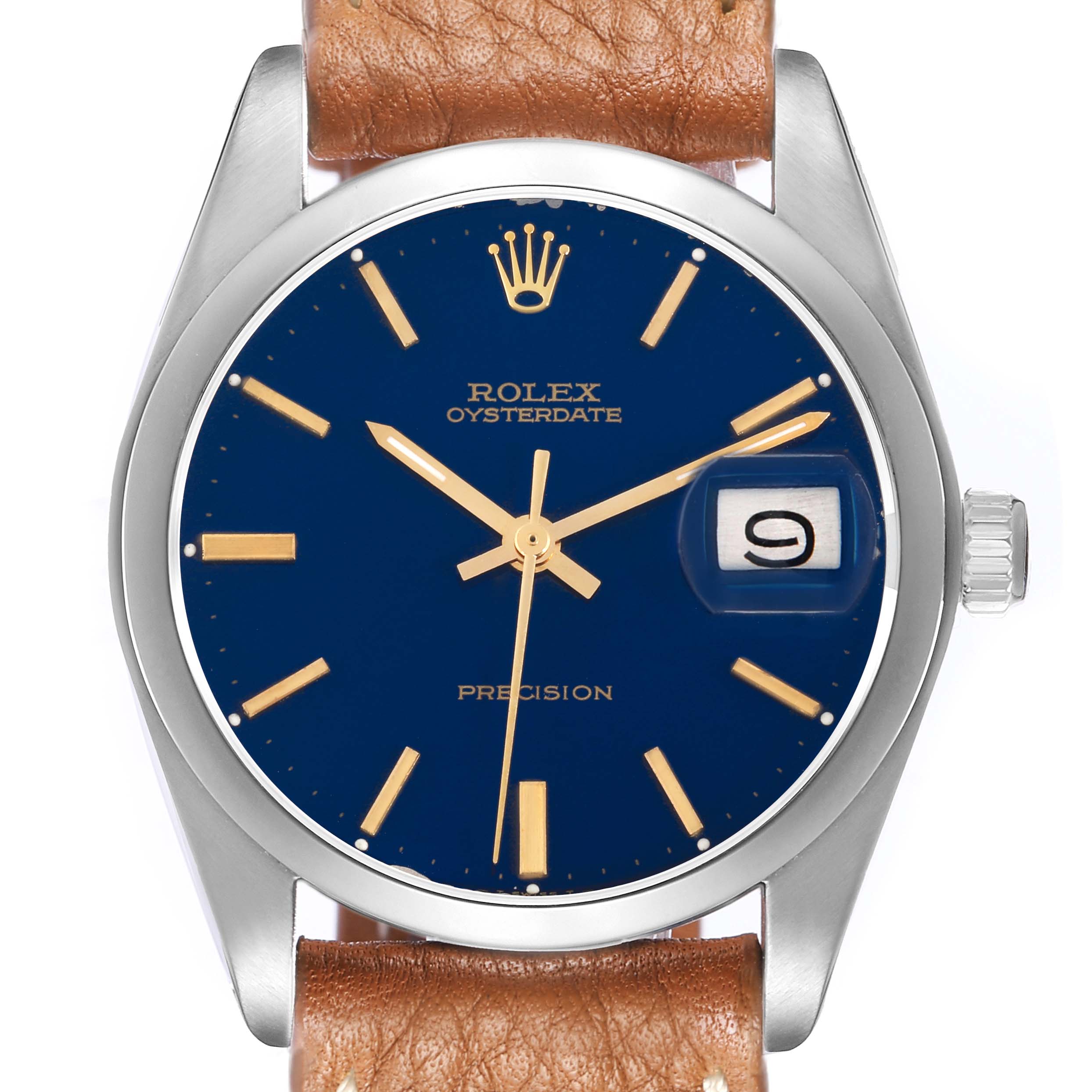 The Rolex Vintage Collection 6694 Men
s Stainless Steel Blue Dial watch is shown from the front, highlighting its blue dial, gold markers, and a brown leather strap.