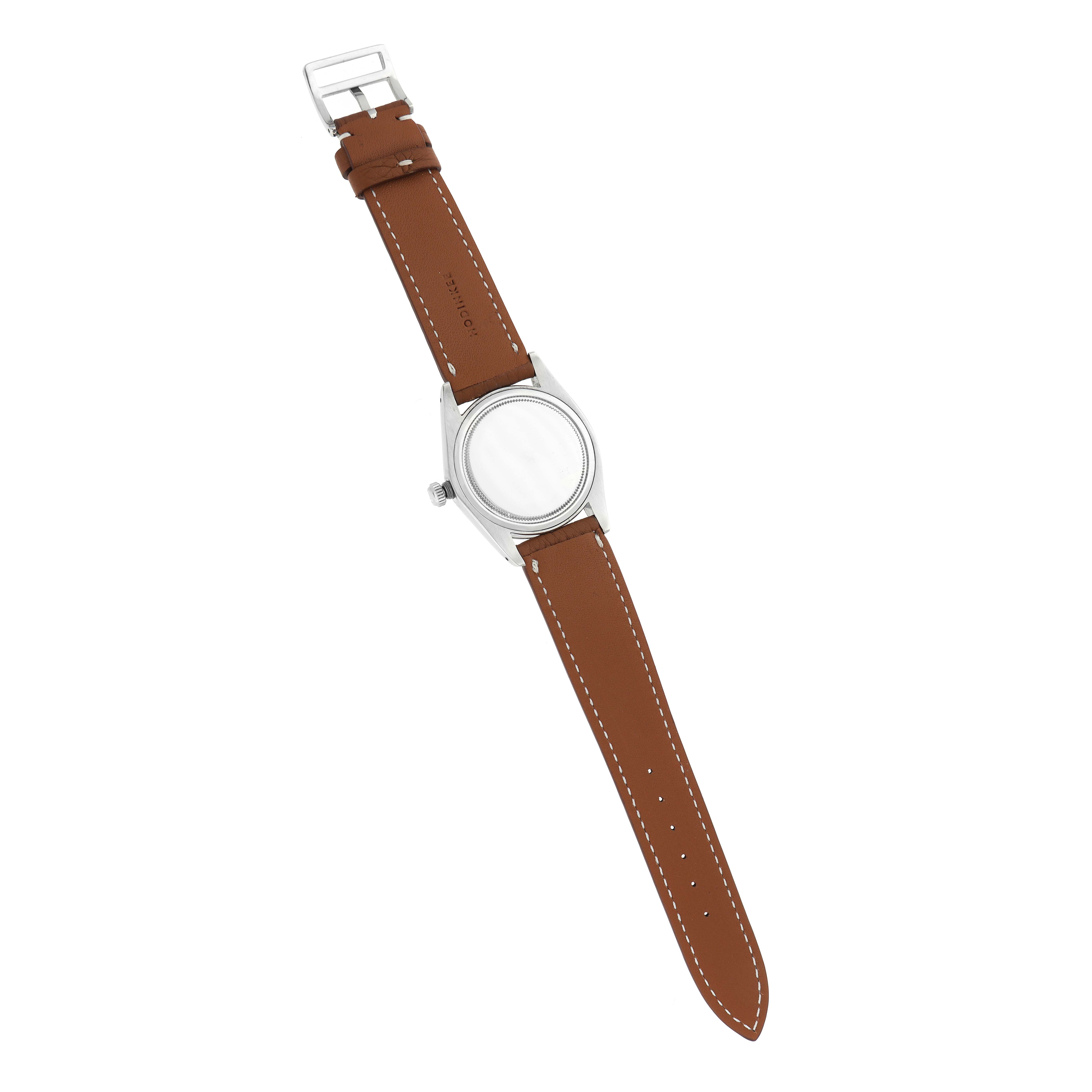 The Rolex Vintage Collection 6694 Men
s Stainless Steel Blue Dial watch is shown from the back, highlighting the case, crown, and brown leather strap.