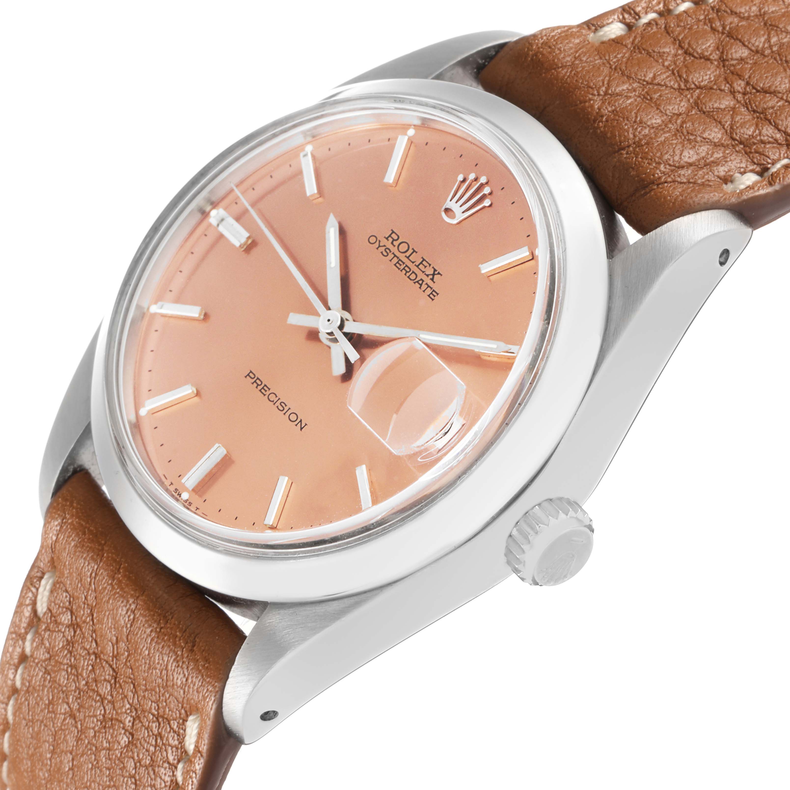 The Rolex Vintage Collection 6694 Men
s Stainless Steel Pink Dial watch is shown at an angle highlighting the dial, crown, and part of the leather strap.