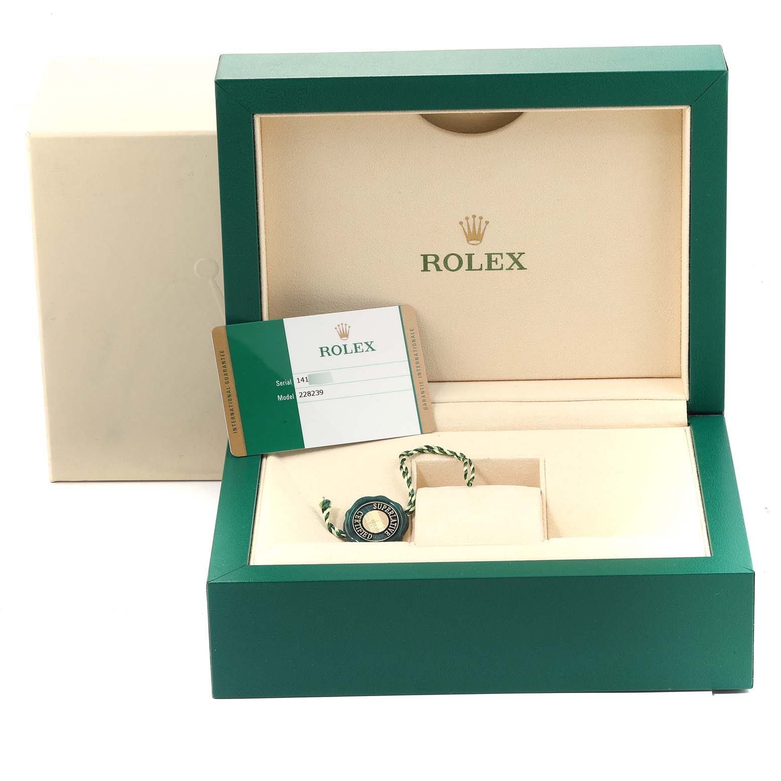 The image shows the packaging, a tag, and a certificate for a Rolex President 228239 Men's White Gold Green Dial 228239 Men's White Gold Green Dial model watch, with the box open at a slight angle.
