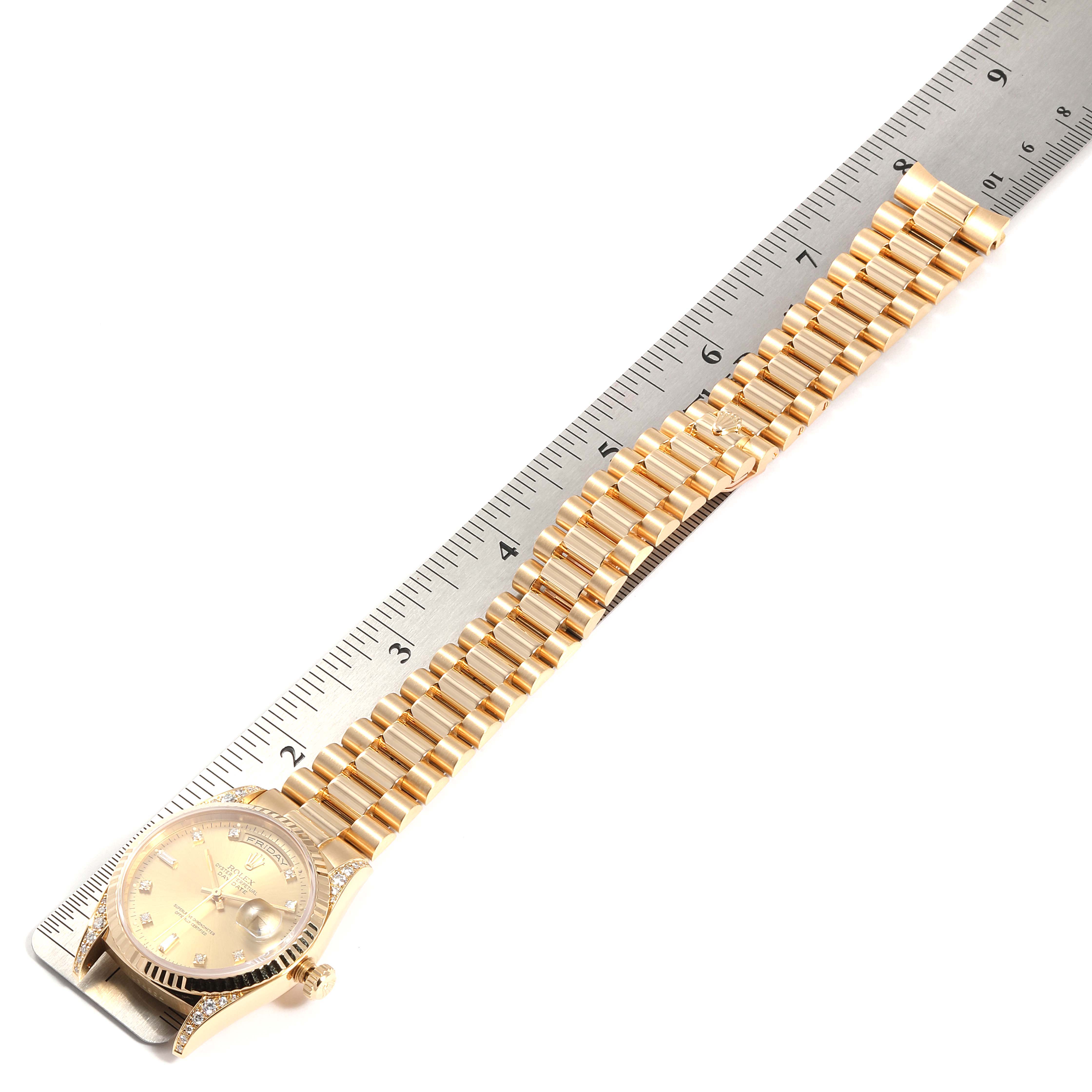 The image shows a Rolex President 18338 Men
s Yellow Gold Champagne Dial 18338 Men
s Yellow Gold Champagne Dial model watch lying flat, with a focus on its bracelet measured against a ruler.