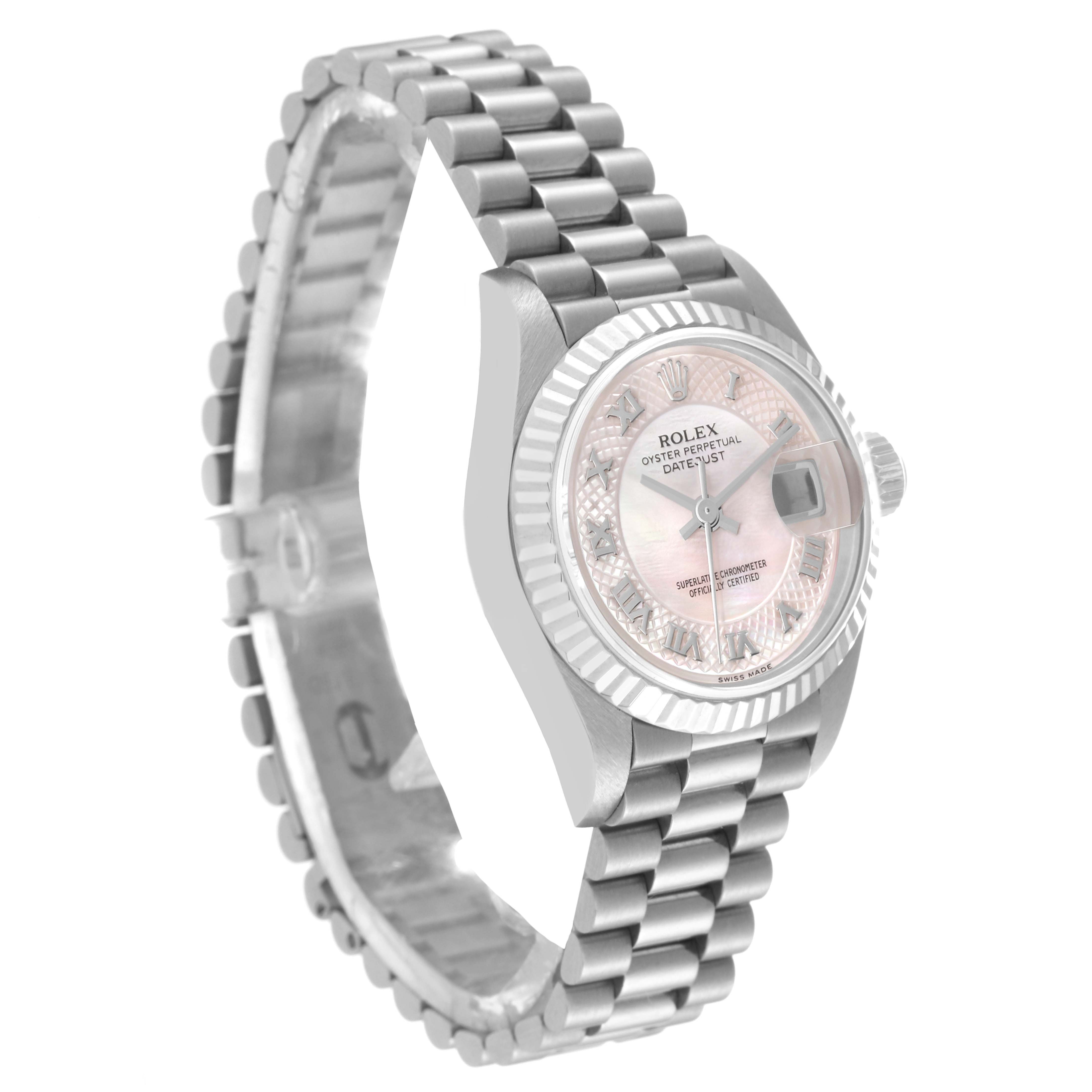 The image shows a side view of a Rolex President 79179 Women's White Gold Mother of Pearl Dial 79179 Women's White Gold Mother of Pearl Dial model watch, featuring its watch face, fluted bezel, and metal bracelet.