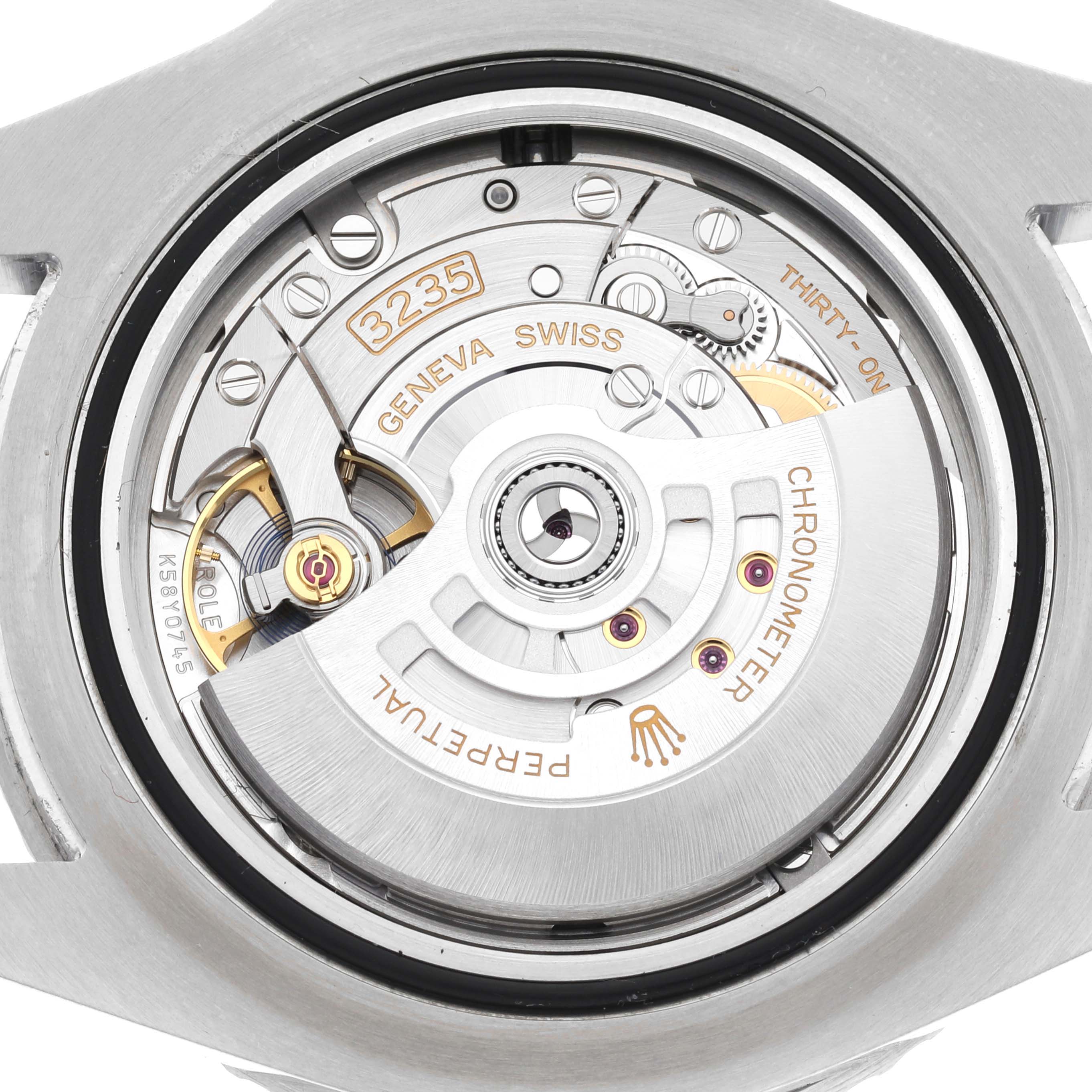 The image shows the movement of a Rolex Sea-Dweller 126600 Men
s Stainless Steel Black Dial, specifically the caliber 3235, viewed from the back.
