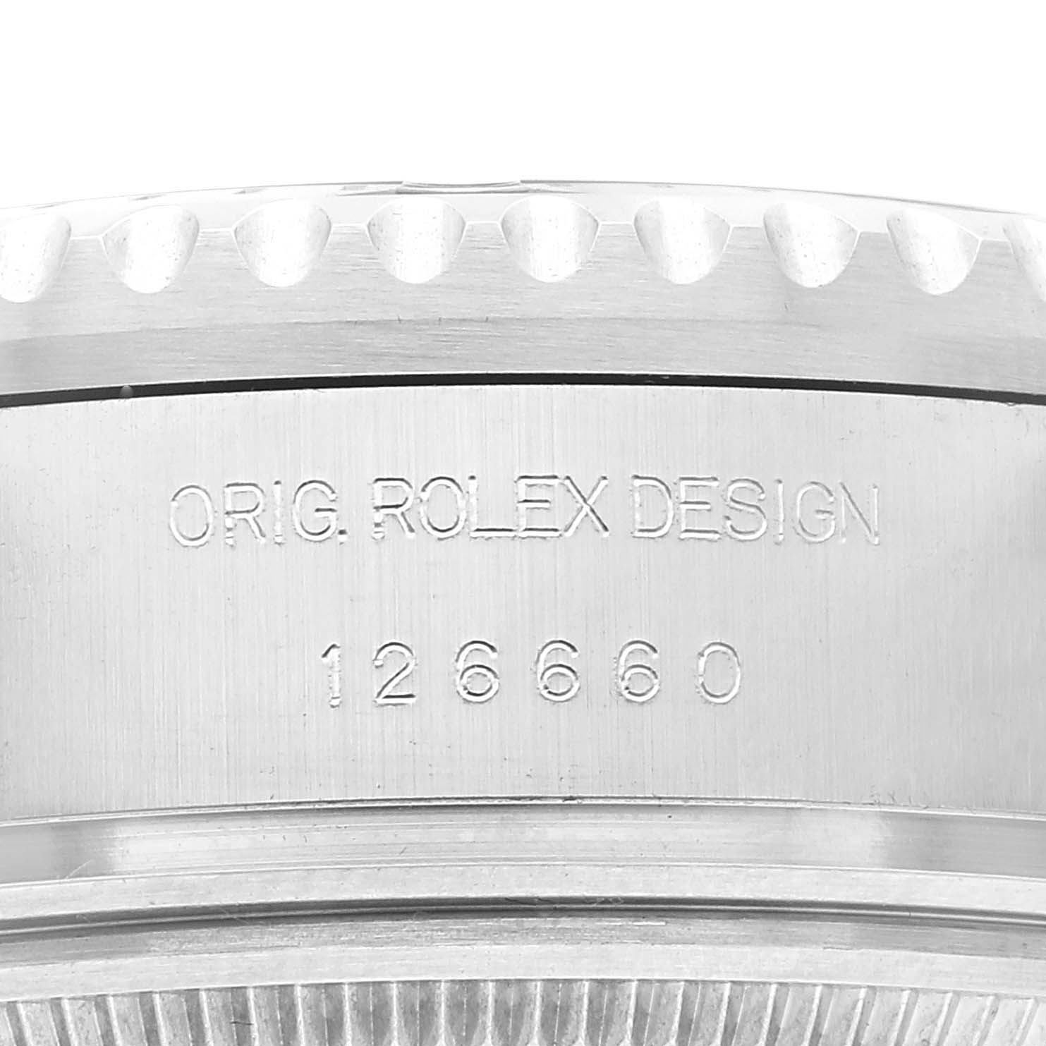 This is a close-up view of the engraved side of a Rolex Sea-Dweller 126660 Men's Stainless Steel Black Dial 126660 Men's Stainless Steel Black Dial case, showing "ORIG. ROLEX DESIGN" and the model number 126660.