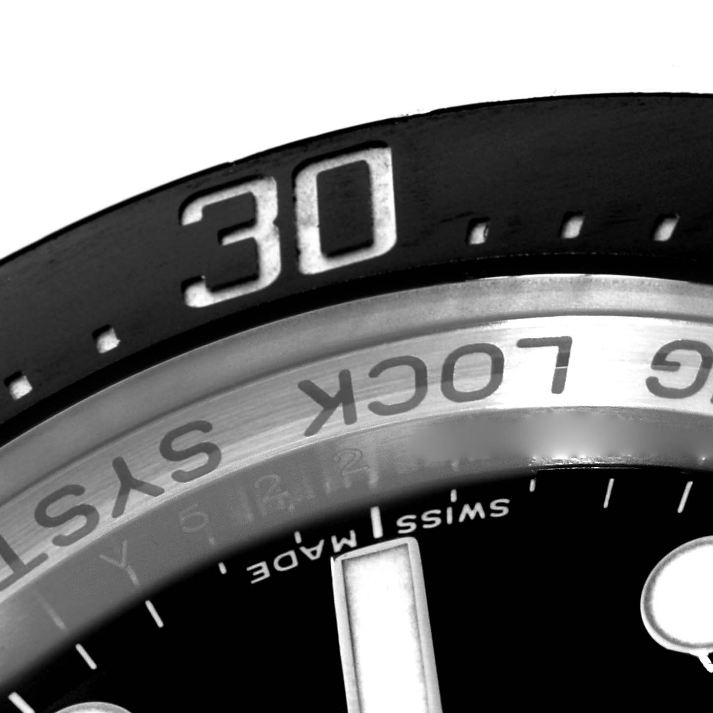 The image shows a close-up of the bezel and part of the dial of a Rolex Sea-Dweller 116660 Men
s Stainless Steel Black Dial 116660 Men
s Stainless Steel Black Dial watch, highlighting the 30-minute marker.
