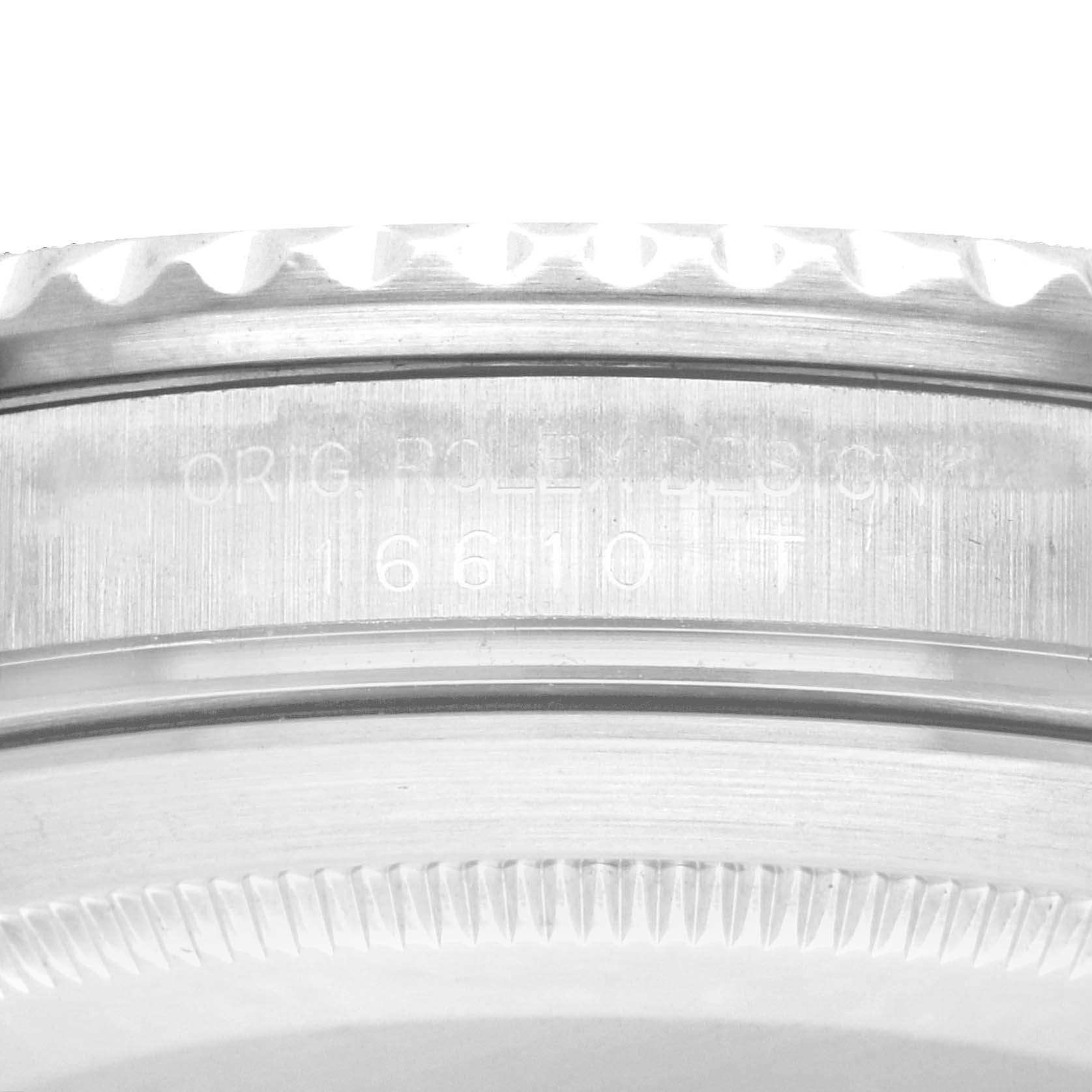 The image shows a close-up view of the engraving on the side of the bezel of a Rolex Submariner 16610 Men
s Stainless Steel Black Dial watch.
