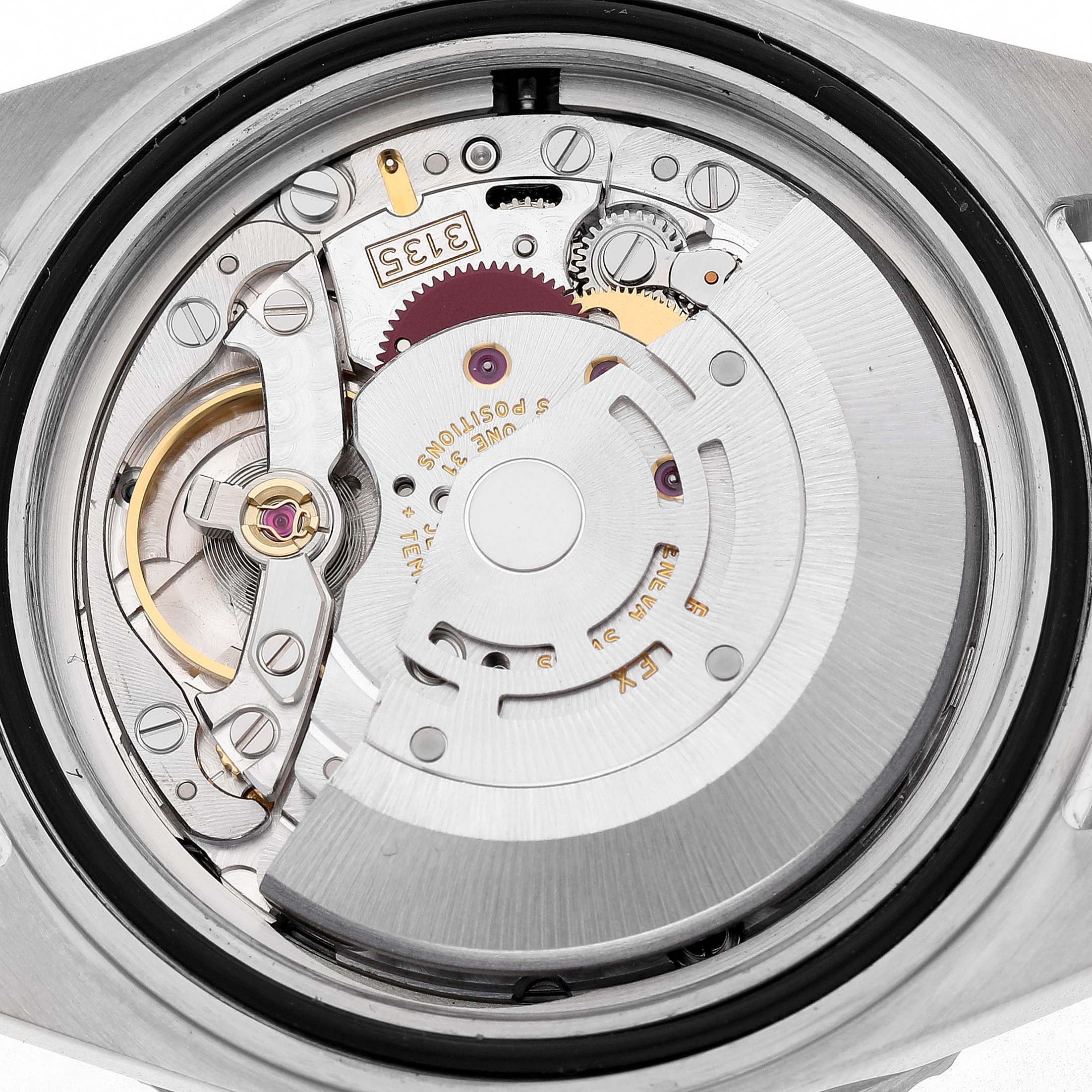 The image shows the internal movement mechanics of a Rolex Submariner 16610 Men's Stainless Steel Black Dial watch from a rear angle.