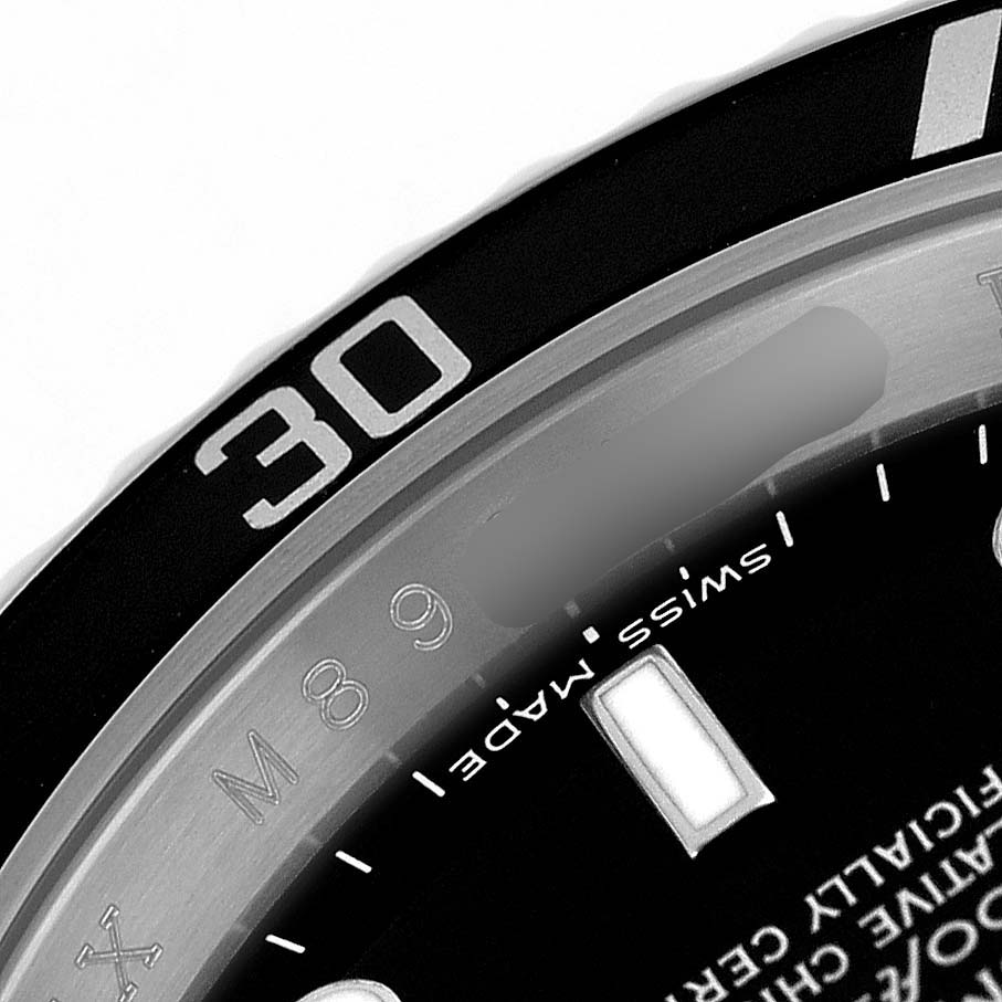 The image shows a close-up of the Rolex Submariner 16610 Men's Stainless Steel Black Dial's bezel, focusing on the "30" marker and part of the dial.