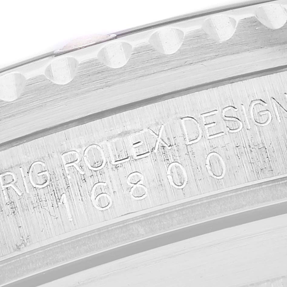 This image shows a close-up of the engraved case and bezel of the Rolex Vintage Collection 16800 Men's Stainless Steel Black Dial 16800 Men's Stainless Steel Black Dial model.