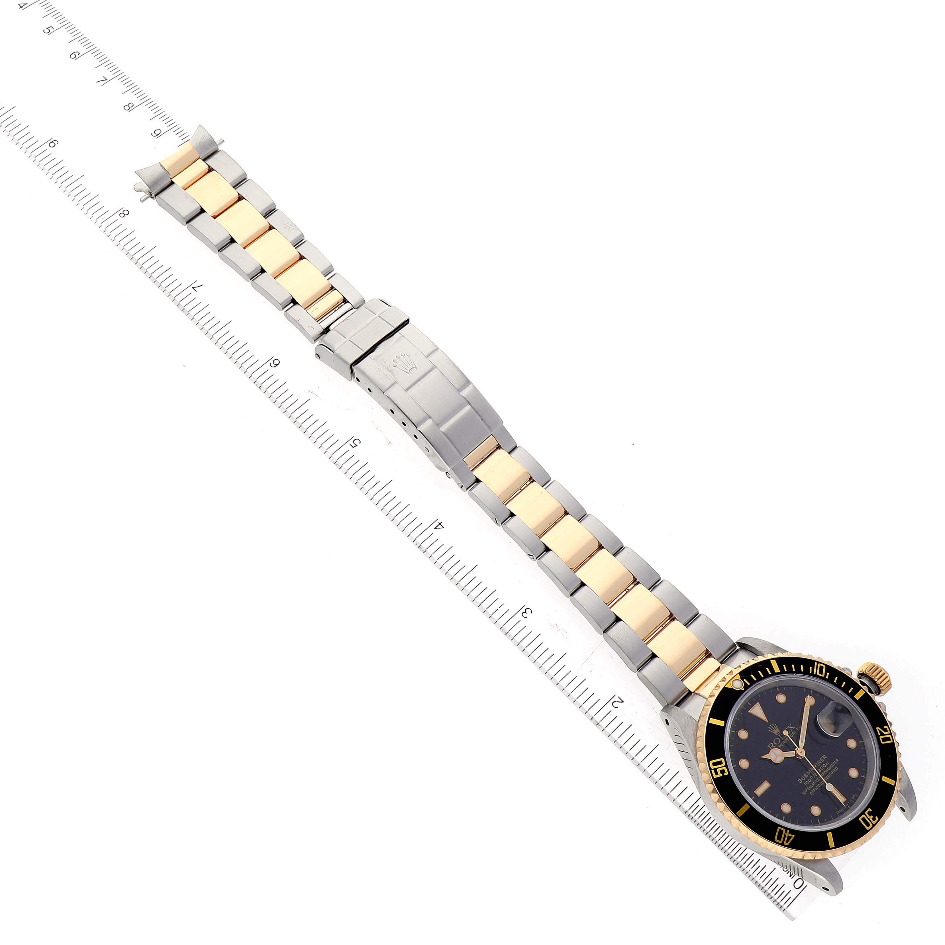 This image shows a Rolex Submariner 16613 Men's Steel and Gold (two tone) Black Dial 16613 Men's Steel and Gold (two tone) Black Dial watch from a top-down angle, featuring the face, bezel, and full bracelet with two-tone links.