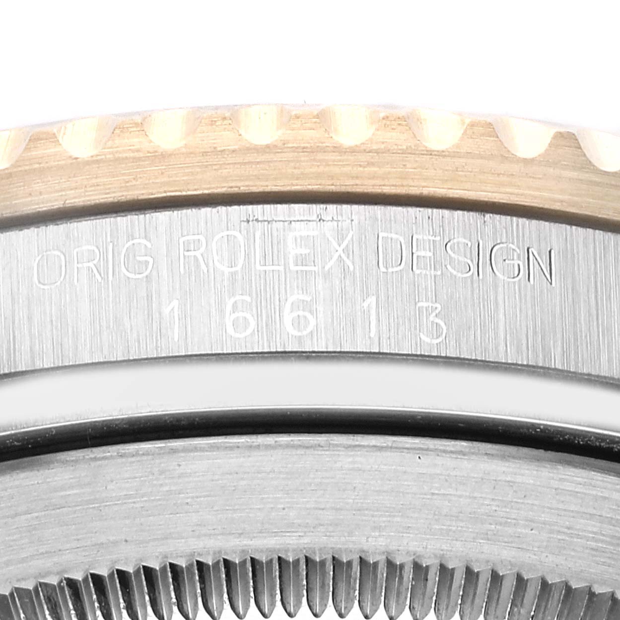 The image shows a close-up of the serial number engraving on the side of the case of a Rolex Submariner 16613 Men's Steel and Gold (two tone) Black Dial 16613 Men's Steel and Gold (two tone) Black Dial watch.