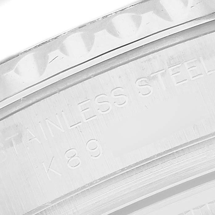 The image shows a close-up of the edge of a Rolex Yacht-Master 169622 Women
s Stainless Steel Silver Dial watch, highlighting the bezel and engraving details.