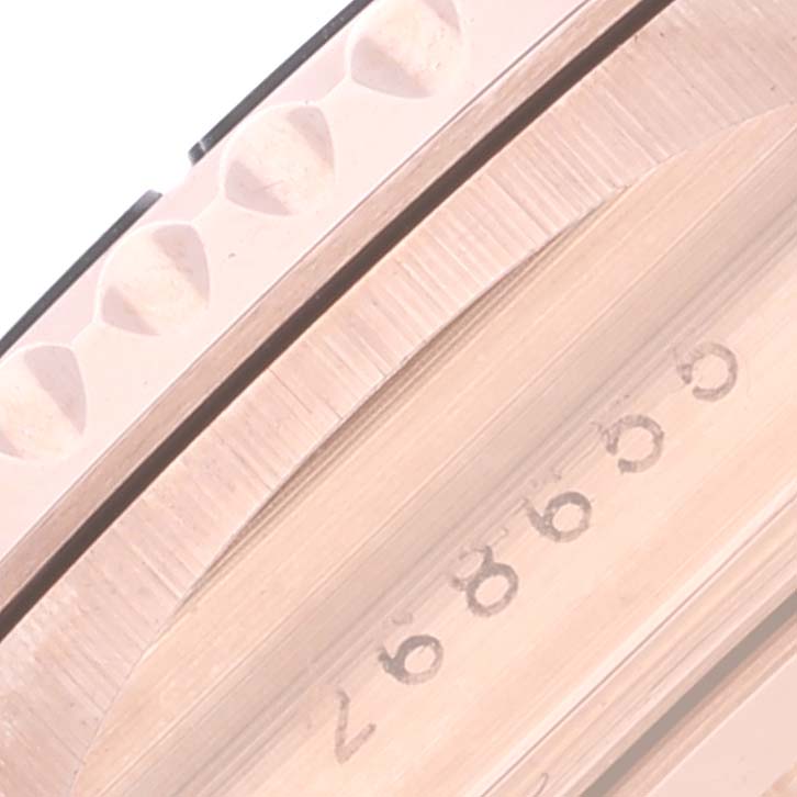 The image shows a close-up of the case side of a Rolex Yacht-Master 268655 Men's Rose Gold Black Dial 268655 Men's Rose Gold Black Dial, focusing on its serial number and part of the bezel.