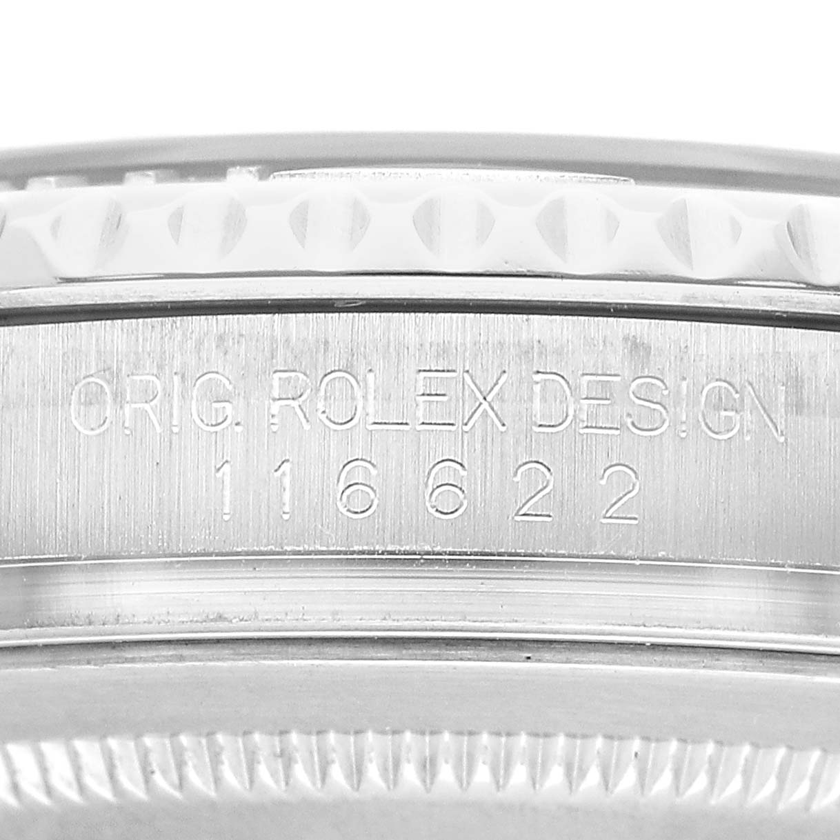 The image shows an angled close-up of the side of the Rolex Yacht-Master 116622 Men's Stainless Steel Blue Dial, highlighting the engraved serial and model numbers.