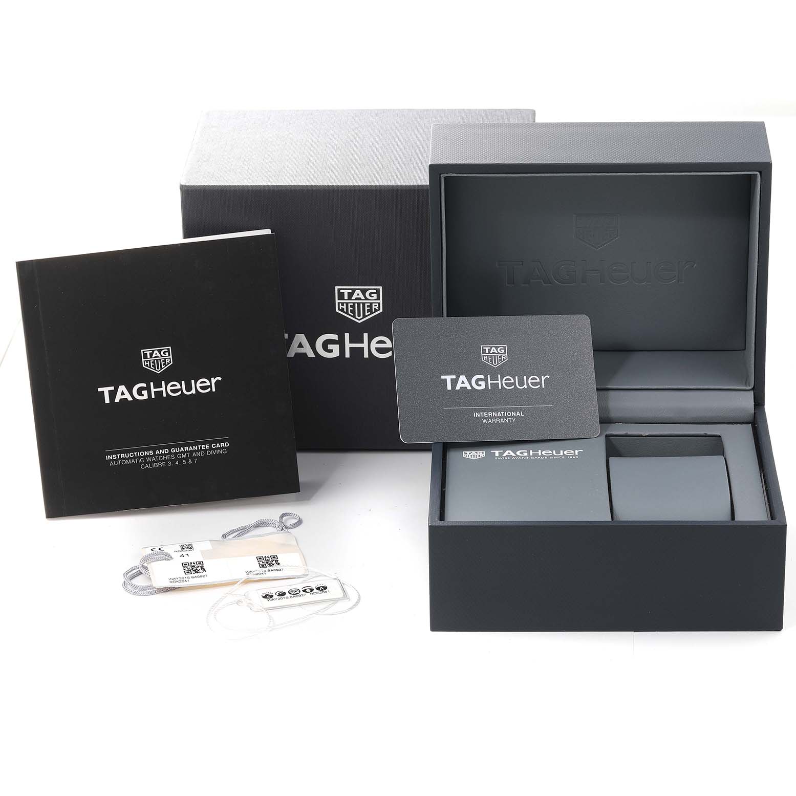 The image shows the box, international warranty card, instruction booklet, and tags for the Tag Heuer Aquaracer WAY2015.BA0927 Men's Stainless Steel Green Dial WAY2015.BA0927 Men's Stainless Steel Green Dial model.