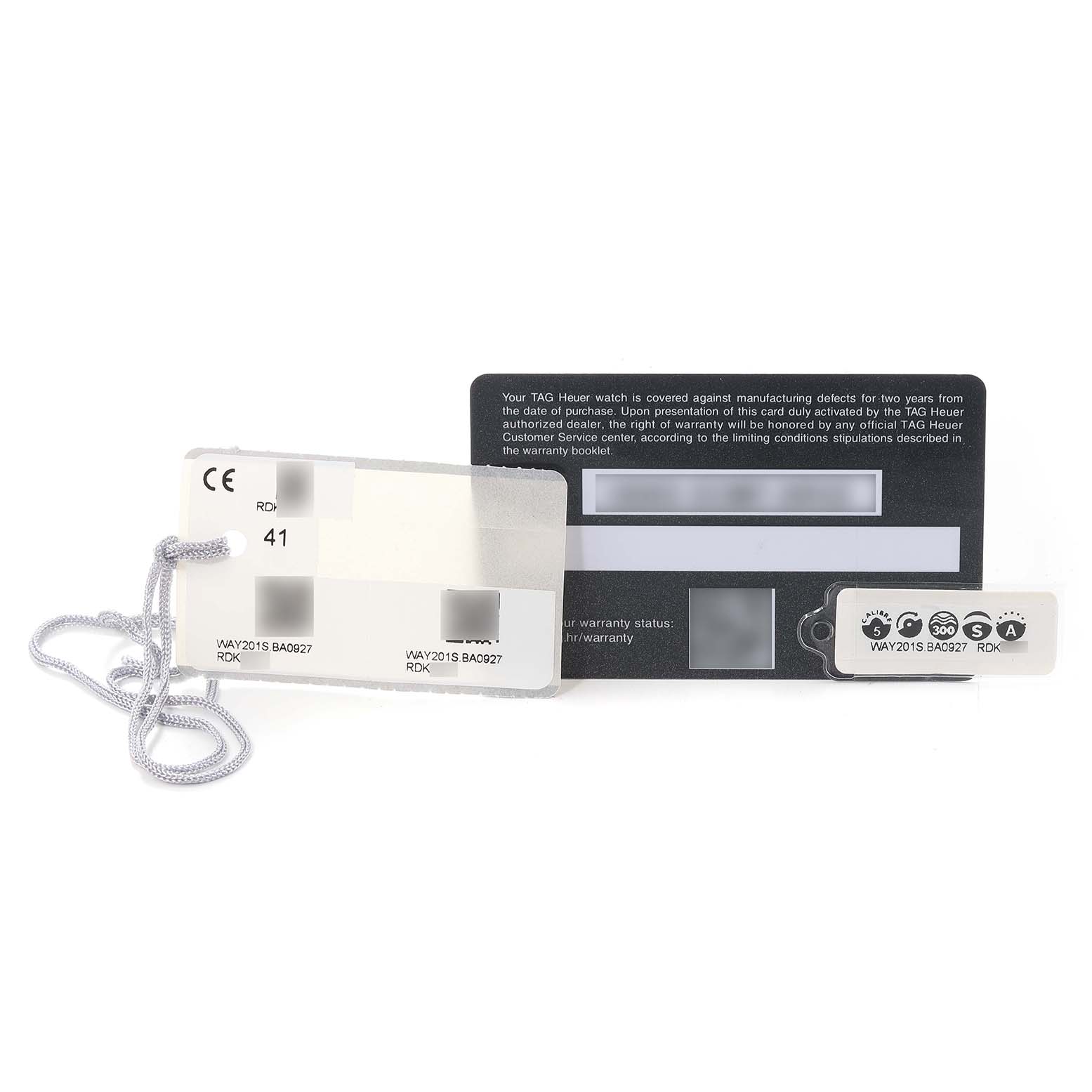 The image shows the warranty card and tags for the Tag Heuer Aquaracer WAY2015.BA0927 Men's Stainless Steel Green Dial WAY2015.BA0927 Men's Stainless Steel Green Dial model, along with a string tag.