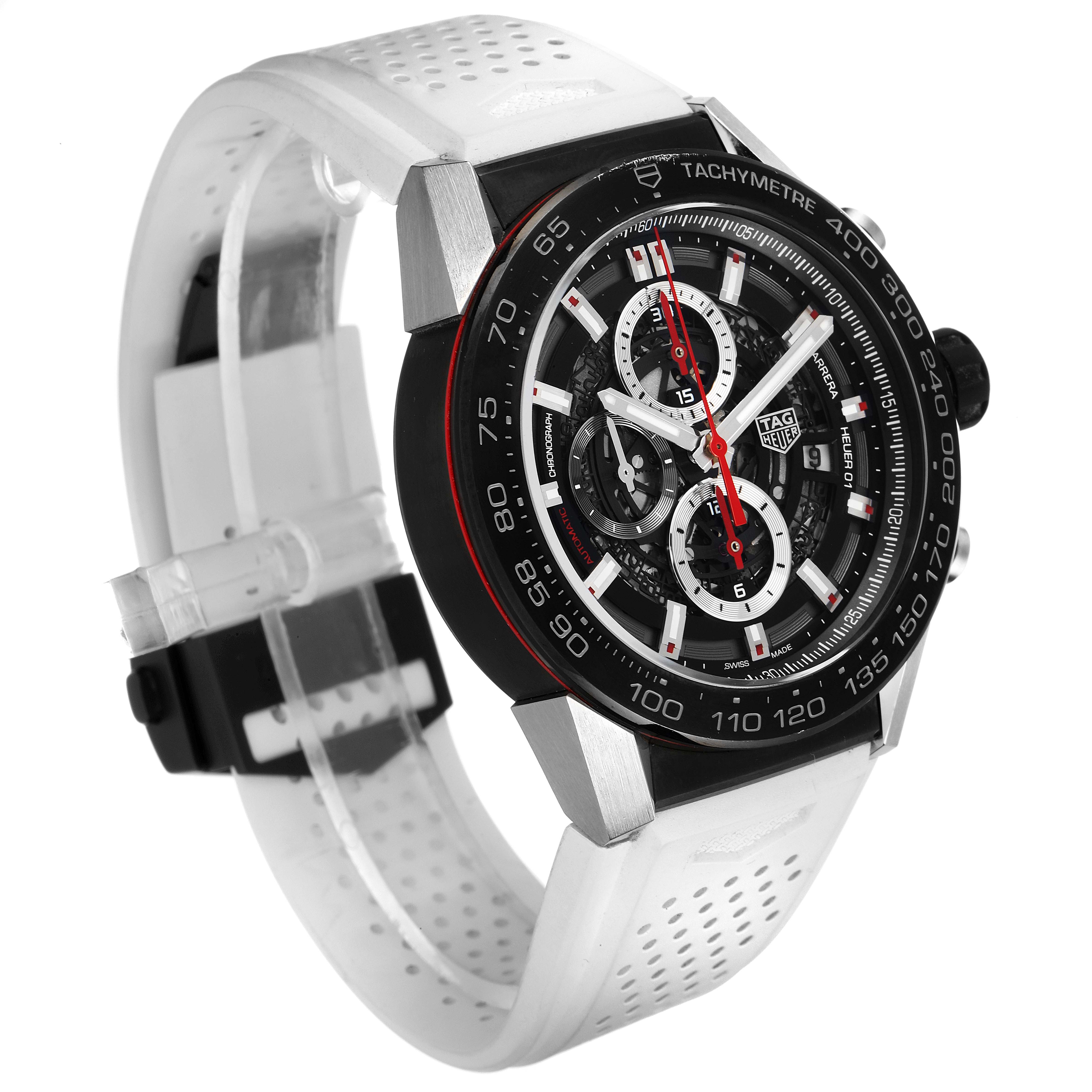 The image shows a Tag Heuer Carrera CAR2A1Z.FT6051 Men
s Stainless Steel Black Dial CAR2A1Z.FT6051 Men
s Stainless Steel Black Dial watch, displaying its face, tachymeter bezel, and white perforated strap at a 3/4 angle.