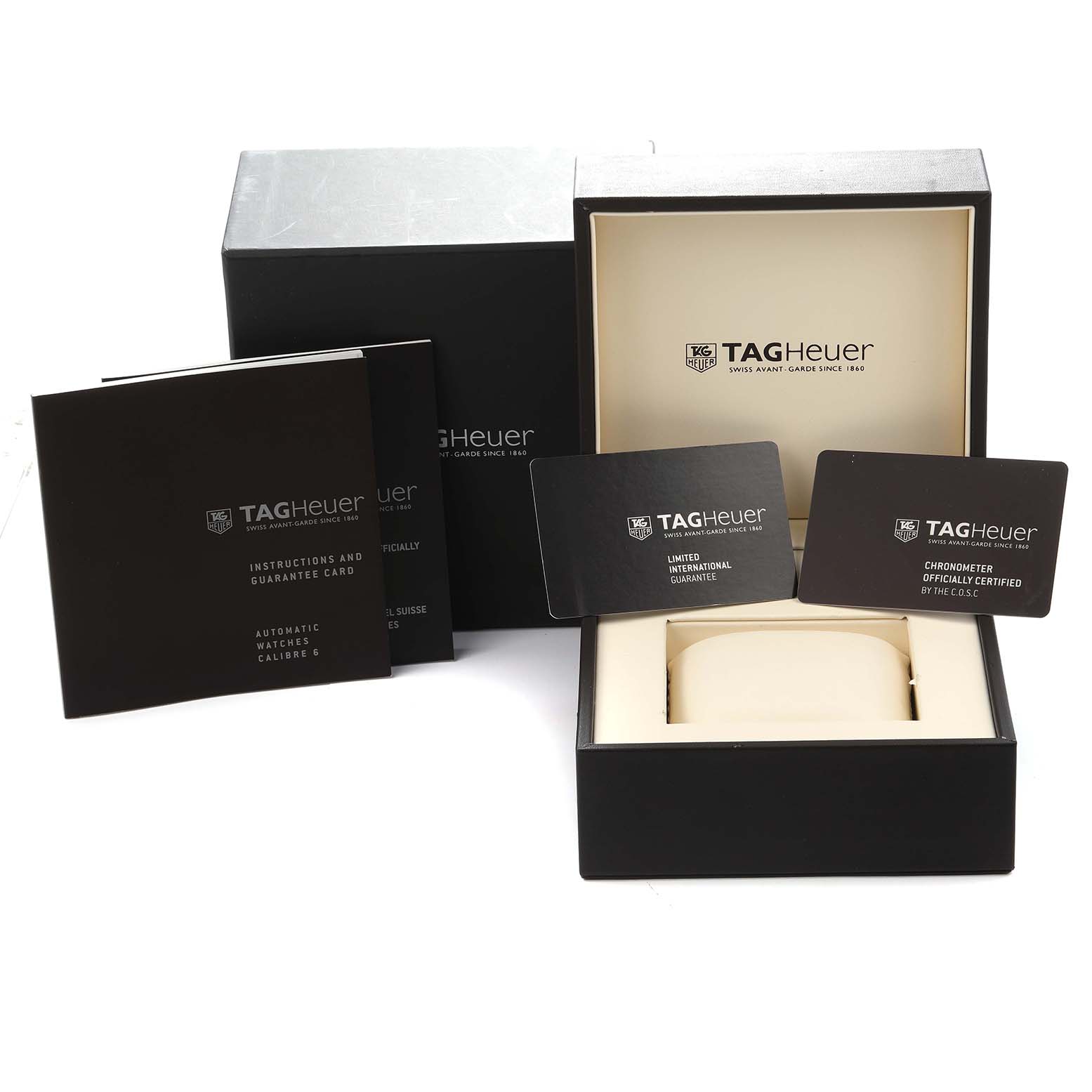 The image shows the packaging and documents for the Tag Heuer Carrera WV5111.FFC6350 Men
s Stainless Steel Silver Dial watch, including the box, manuals, and guarantee cards.