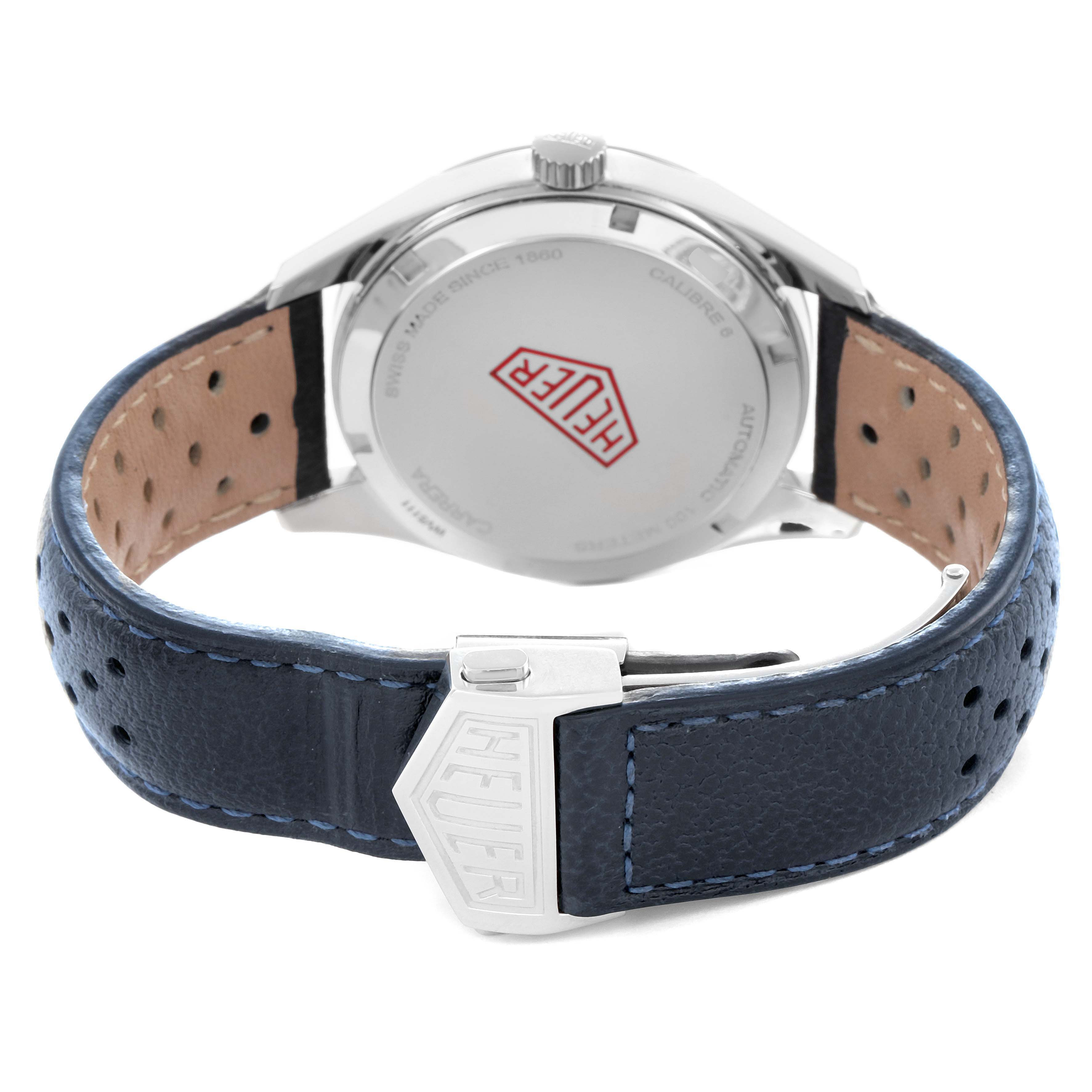 The image shows the back case and buckle of a Tag Heuer Carrera WV5111.FFC6350 Men
s Stainless Steel Silver Dial watch, featuring a leather strap and Heuer logo on the clasp.