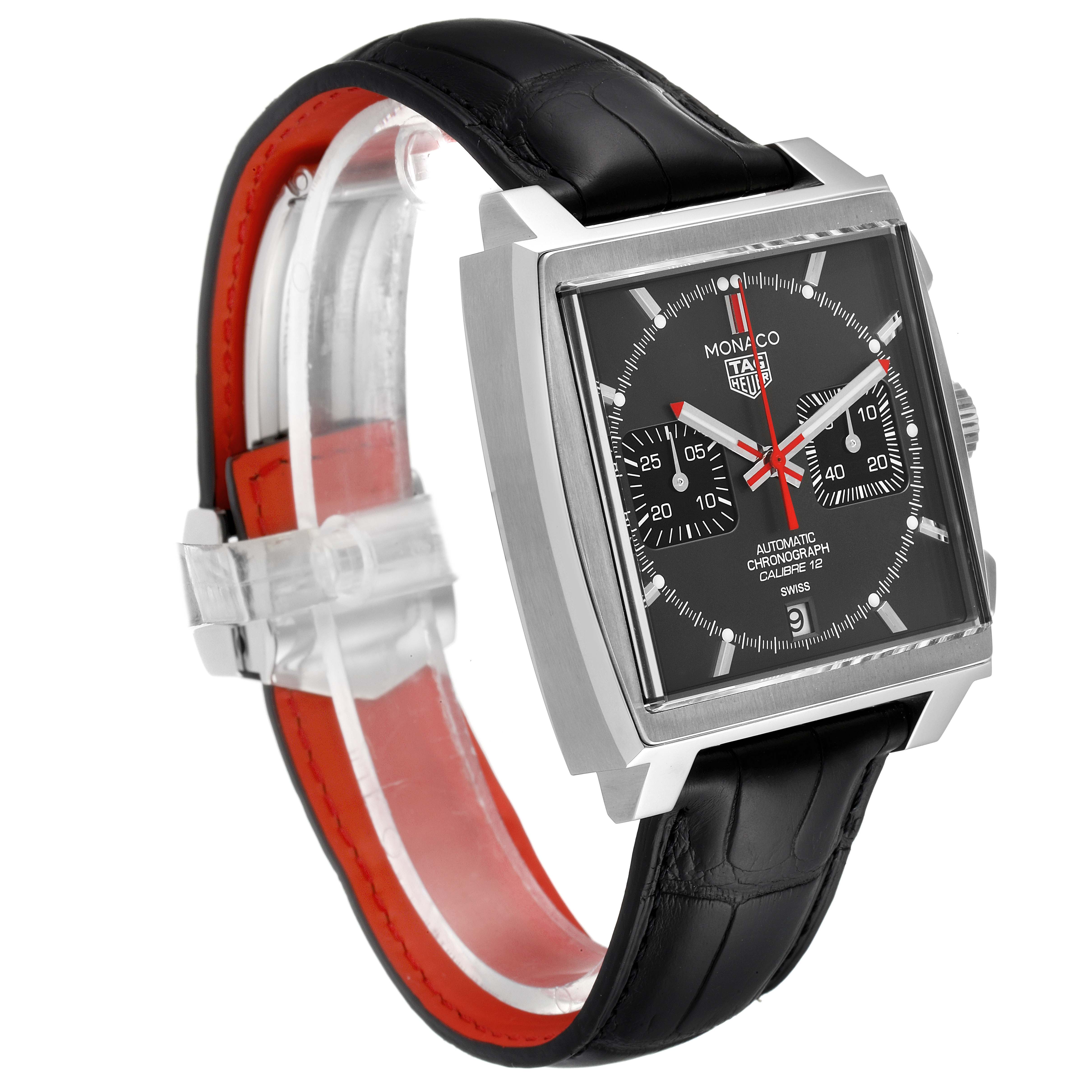 The image shows a Tag Heuer Monaco watch at a three-quarter angle, highlighting its case, dial, and part of the strap.