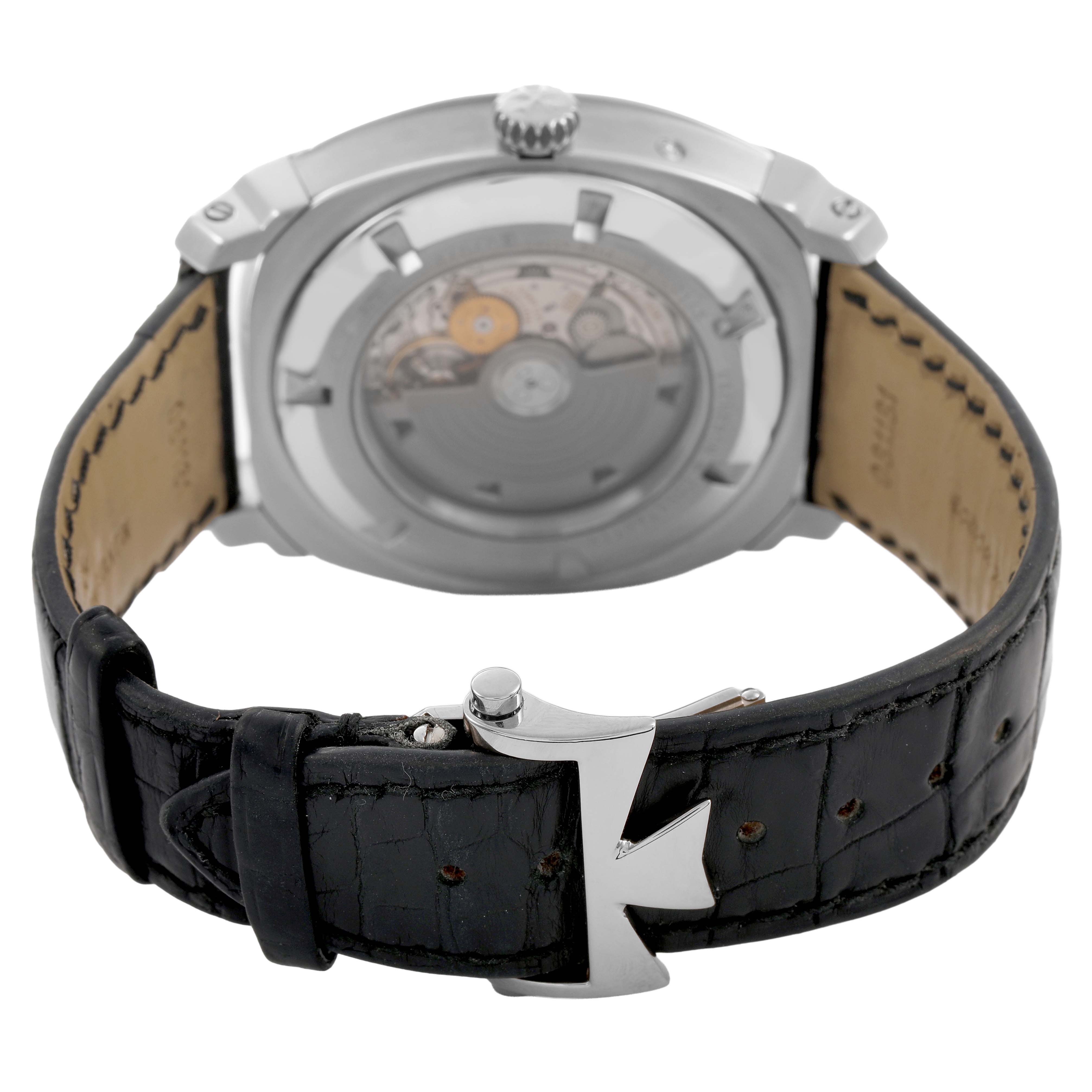 The image shows the back view of a Vacheron Constantin Quai de L’ile watch with a visible movement and a black leather strap.