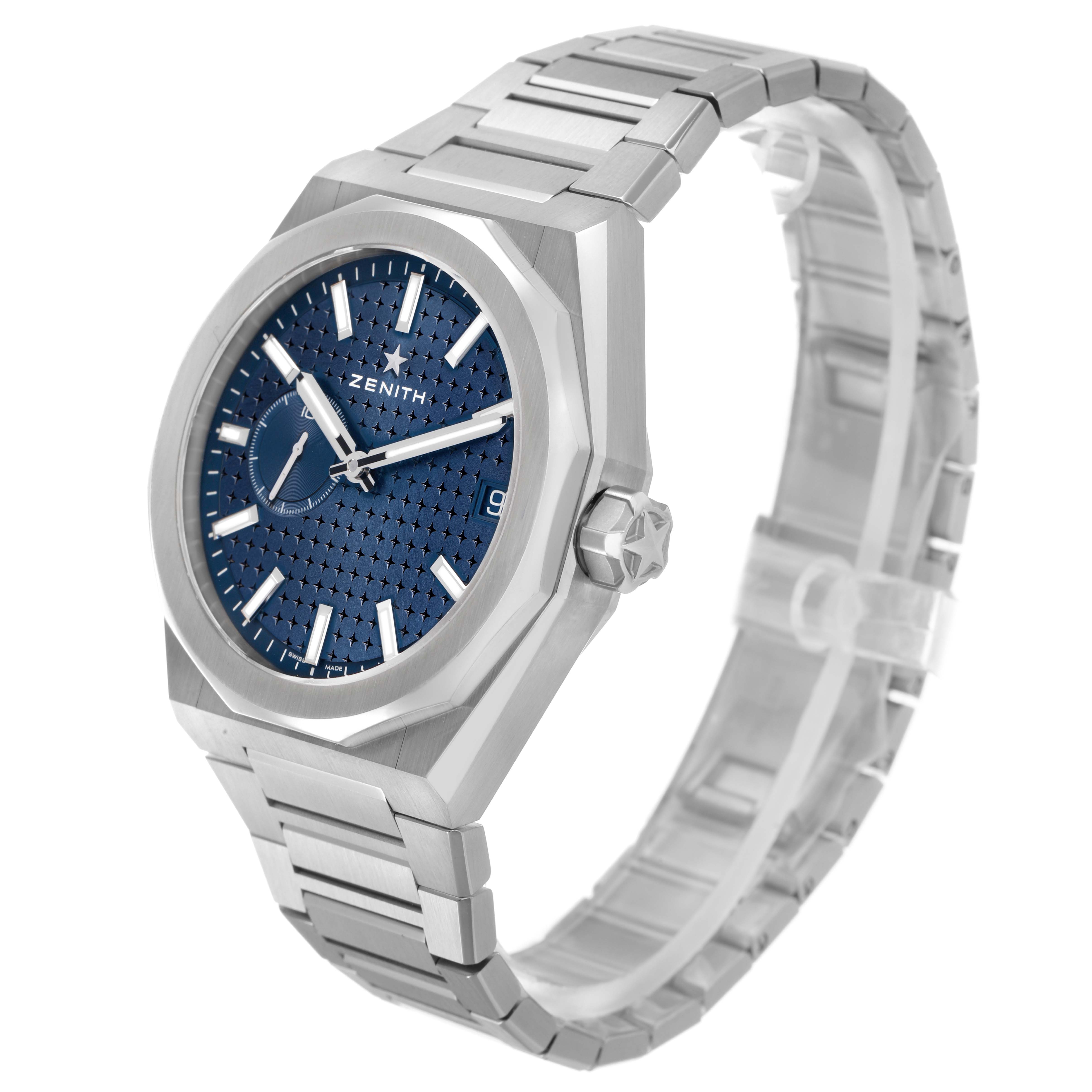 The Zenith Defy 03.9300.3620 / 51.I001 Men's Stainless Steel Blue Dial watch is shown from an angled side view, highlighting the blue dial, case, crown, and metal bracelet.