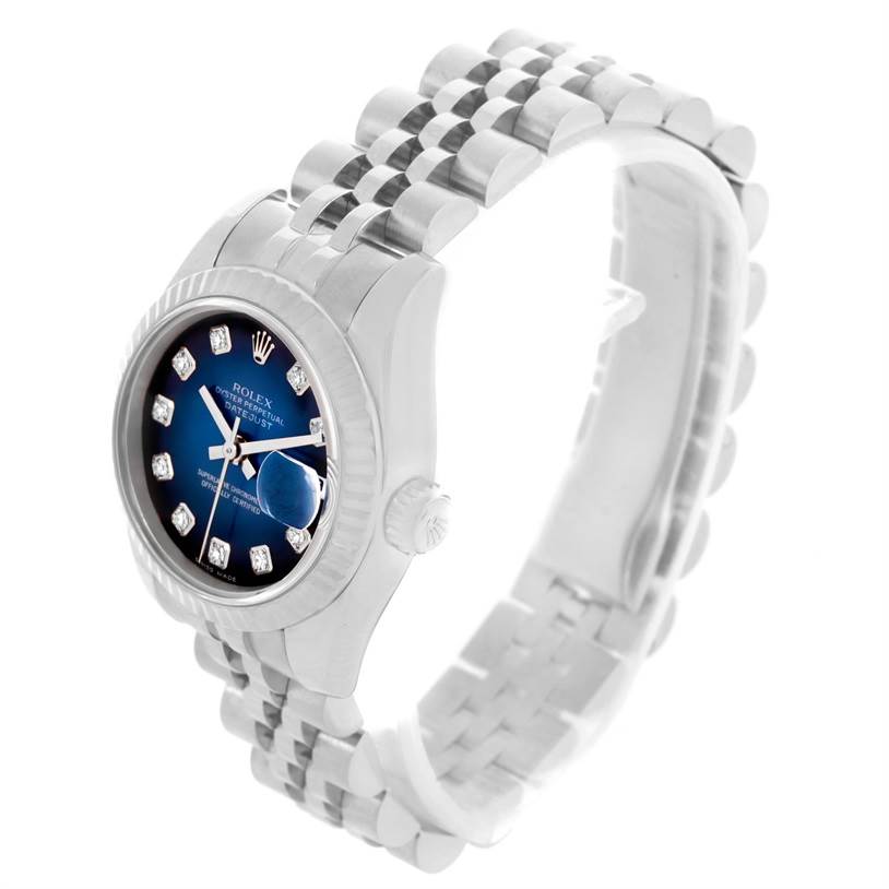 The Rolex 179174 Women's Stainless Steel Blue Dial 179174 Women's Stainless Steel Blue Dial Datejust Steel White Gold Vignette Diamond Dial Watch 179174 is shown at a tilted angle, displaying both the face and part of the band.