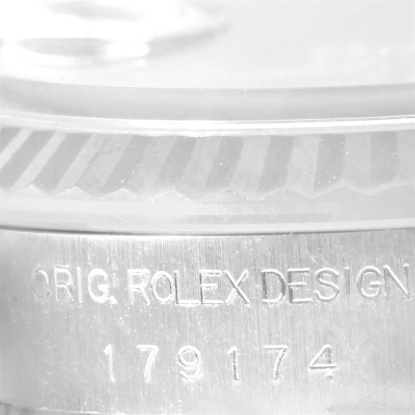 The image shows a close-up of the Rolex 179174 Women's Stainless Steel Blue Dial 179174 Women's Stainless Steel Blue Dial Datejust Steel White Gold Vignette Diamond Dial Watch 179174, highlighting the engraving.