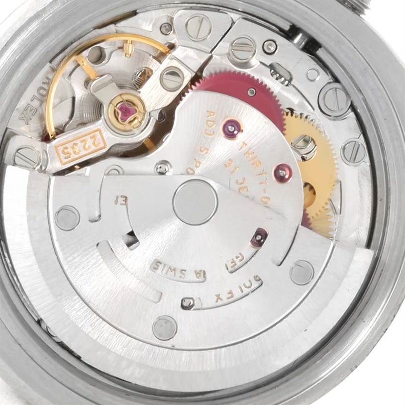 The image shows a close-up of the movement mechanism inside the Rolex 179174 Women's Stainless Steel Blue Dial 179174 Women's Stainless Steel Blue Dial Datejust Steel White Gold Vignette Diamond Dial Watch 179174.