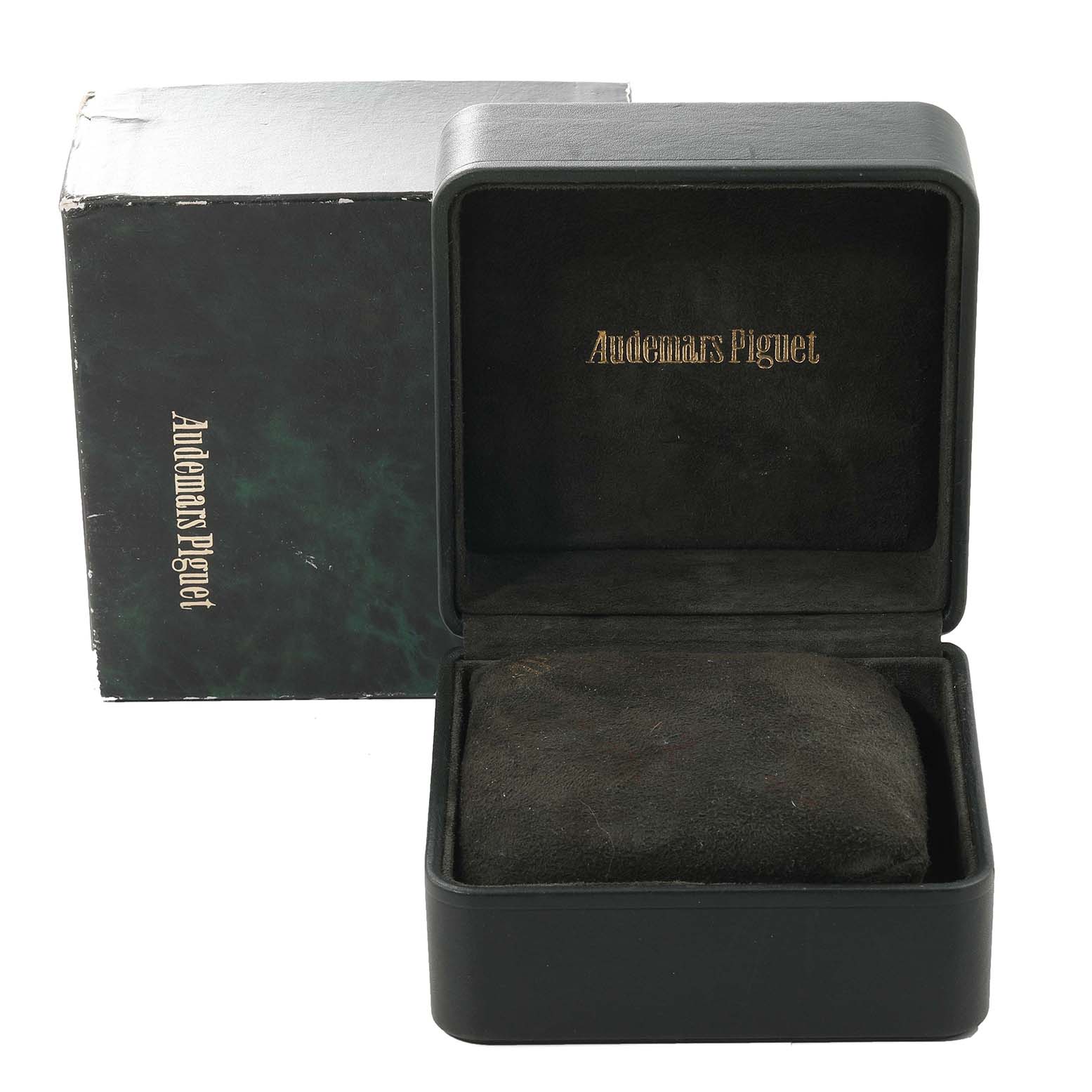 The image shows an open Audemars Piguet watch box for the Royal Oak model, along with its outer packaging.