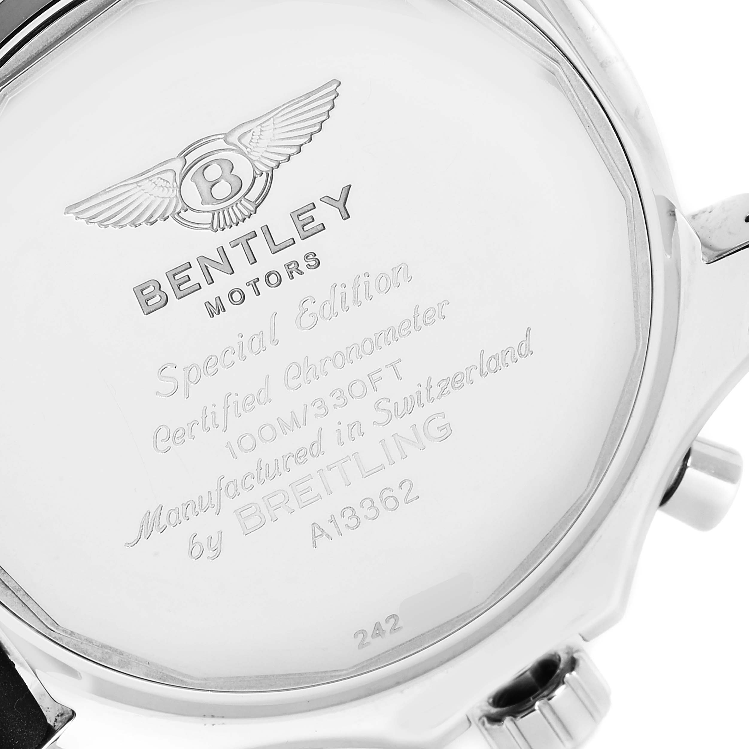 The image shows the back case of a Bentley model watch by Breitling, displaying engraved text and logos.