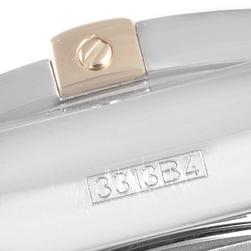 The image shows a close-up of the side of a Breitling Chronomat IB0110 Men's Steel and Gold (two tone) Blue Dial IB0110 Men's Steel and Gold (two tone) Blue Dial watch with the model number engraved and a gold screw detail.