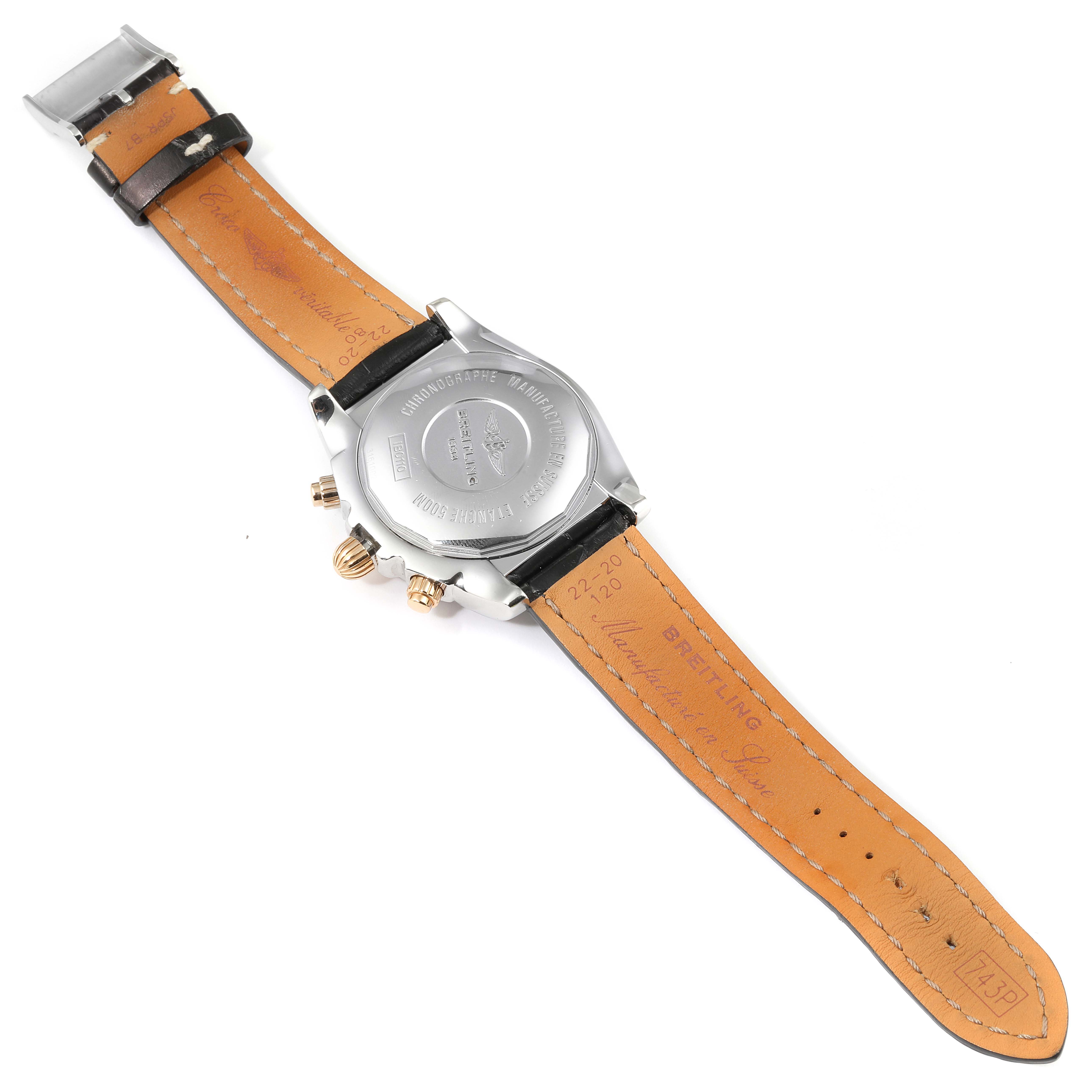 The image shows the back view of a Breitling Chronomat IB0110 Men's Steel and Gold (two tone) Blue Dial IB0110 Men's Steel and Gold (two tone) Blue Dial watch, highlighting the case back, leather strap, and clasp.