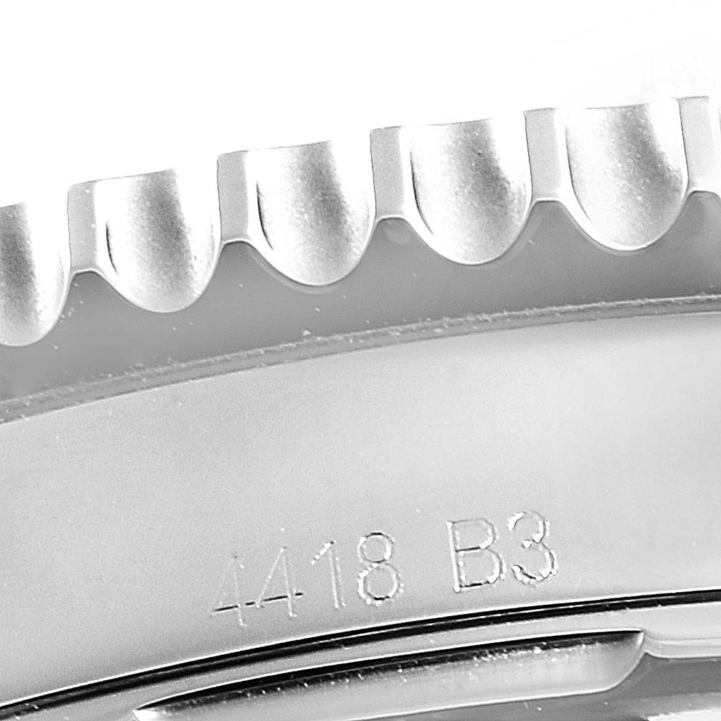 The image shows a close-up of the case side and bezel of a Breitling Navitimer AB0120 Men
s Stainless Steel Silver Dial AB0120 Men
s Stainless Steel Silver Dial watch.