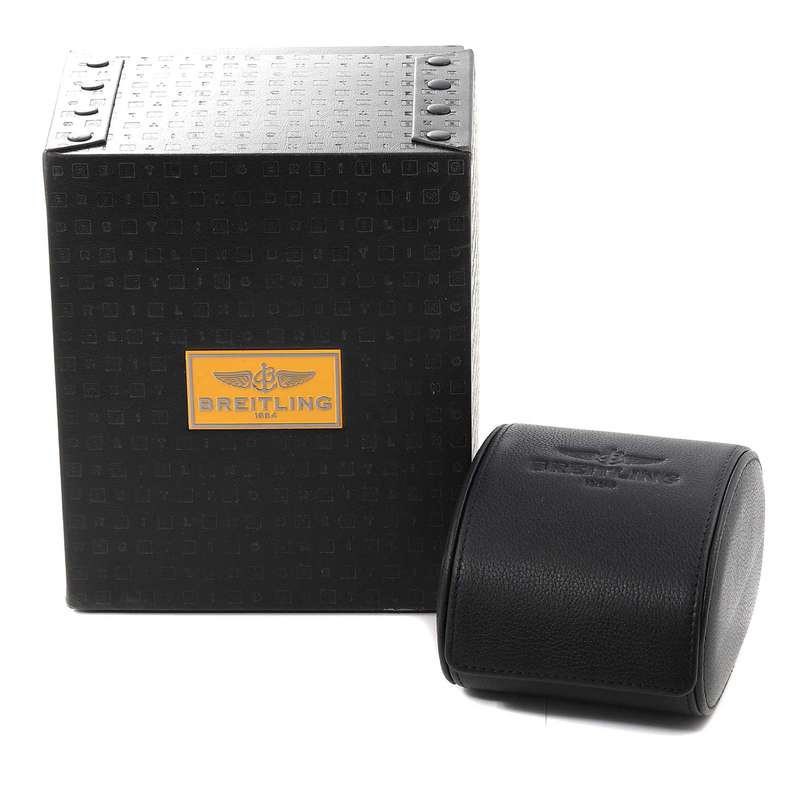 The image shows the packaging and carrying case for a Breitling Limited Series model, with both items angled to display the branding.