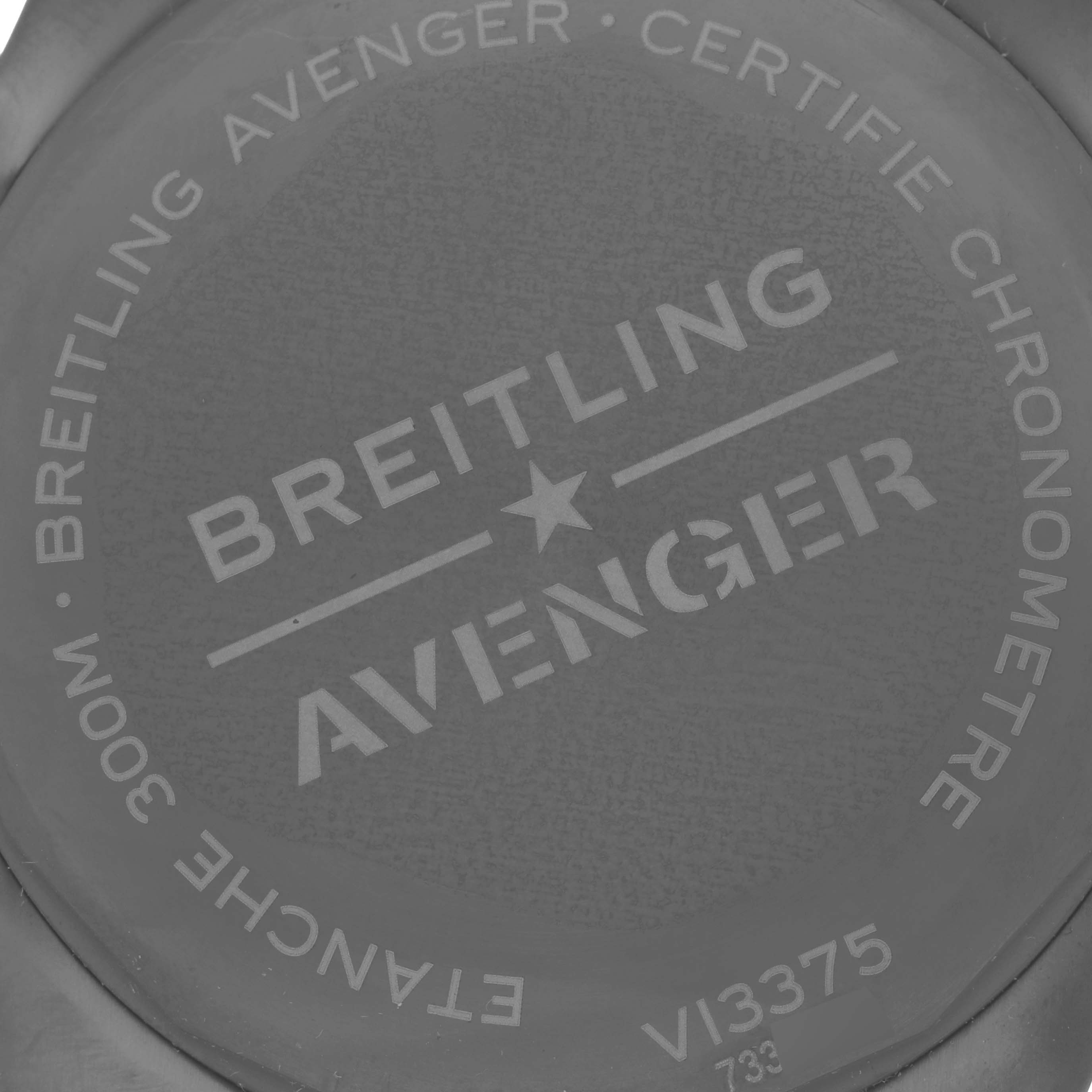 The image shows the back case of a Breitling Avenger V13375 Men's Titanium Blue Dial watch with branding and specifications.