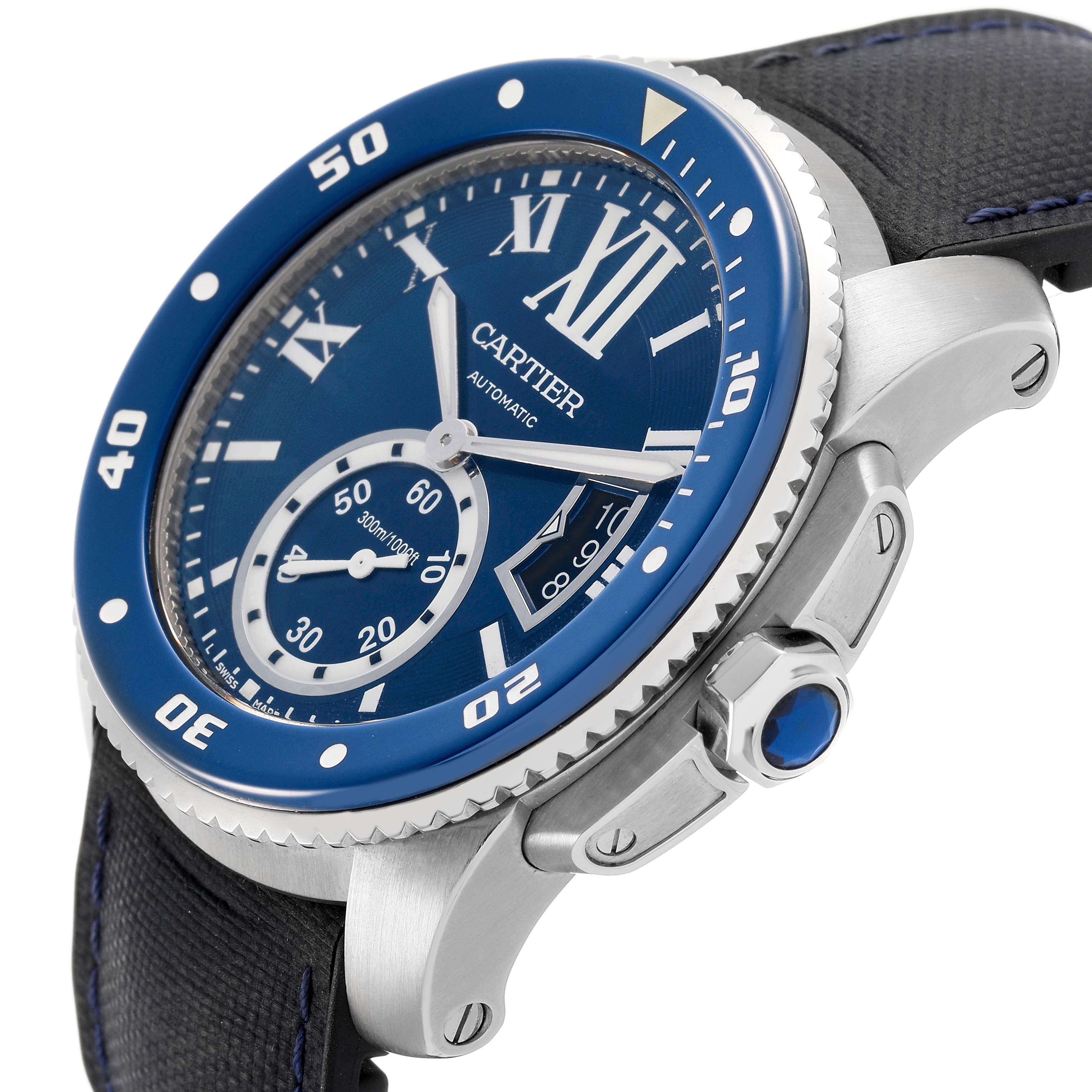The Calibre de Cartier watch is shown at an angled view highlighting the blue bezel, dial, crown, and part of the strap.