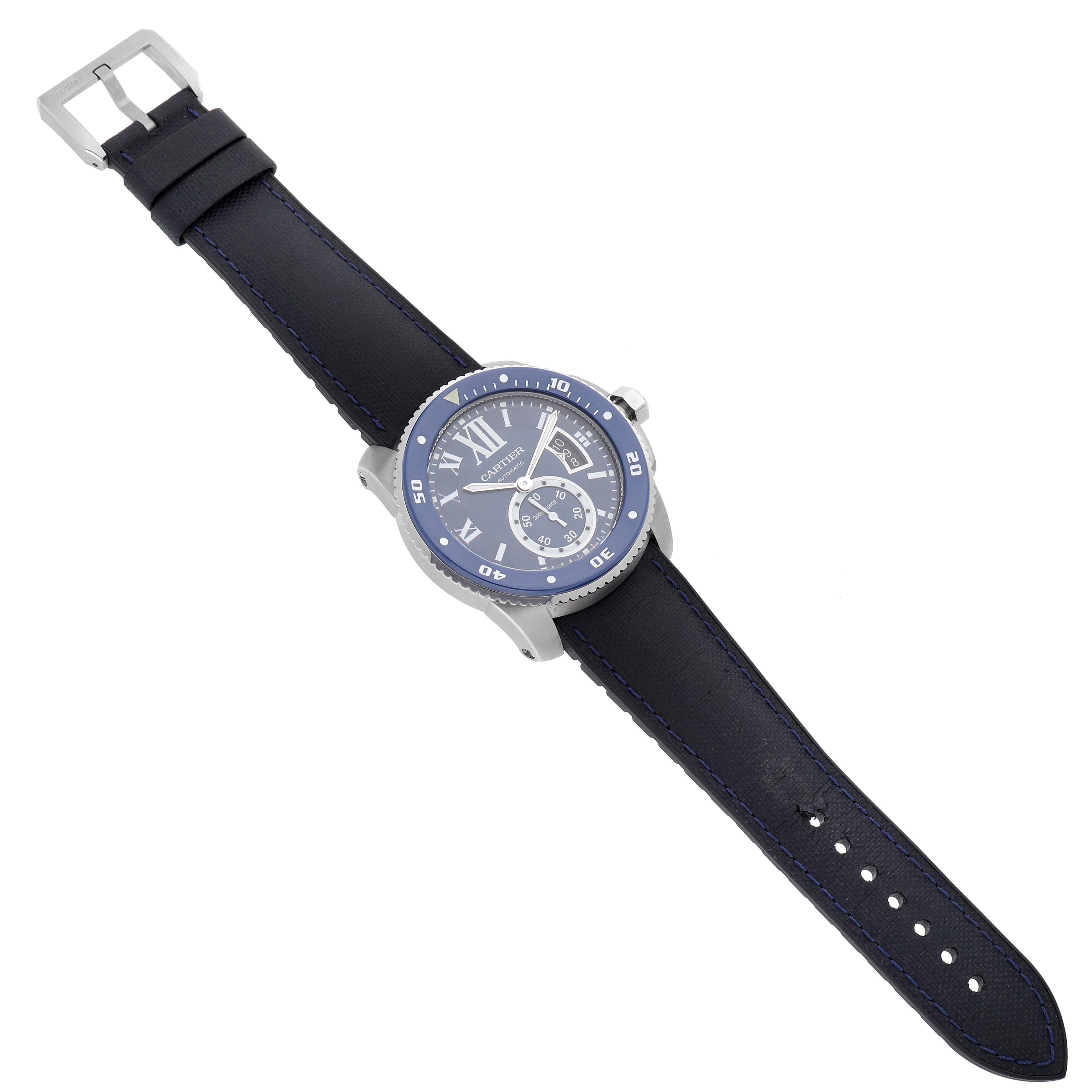 The Calibre de Cartier watch is shown from an angled top view, displaying the face, bezel, and leather strap clearly.